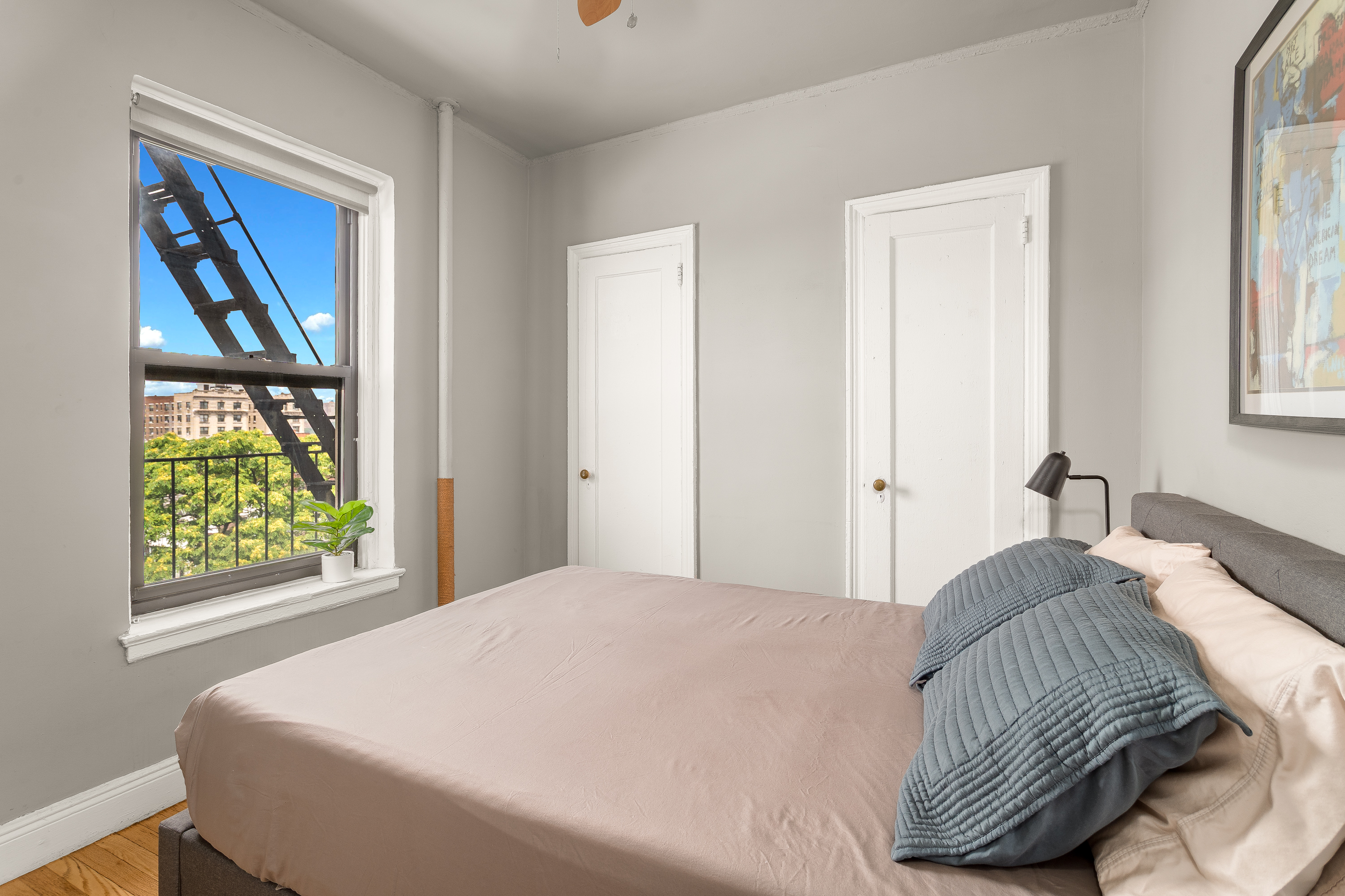 94 Hamilton Place, Unit 6E Manhattan, NY 10031 - Photo 9 of 16 a bedroom with a bed and a window