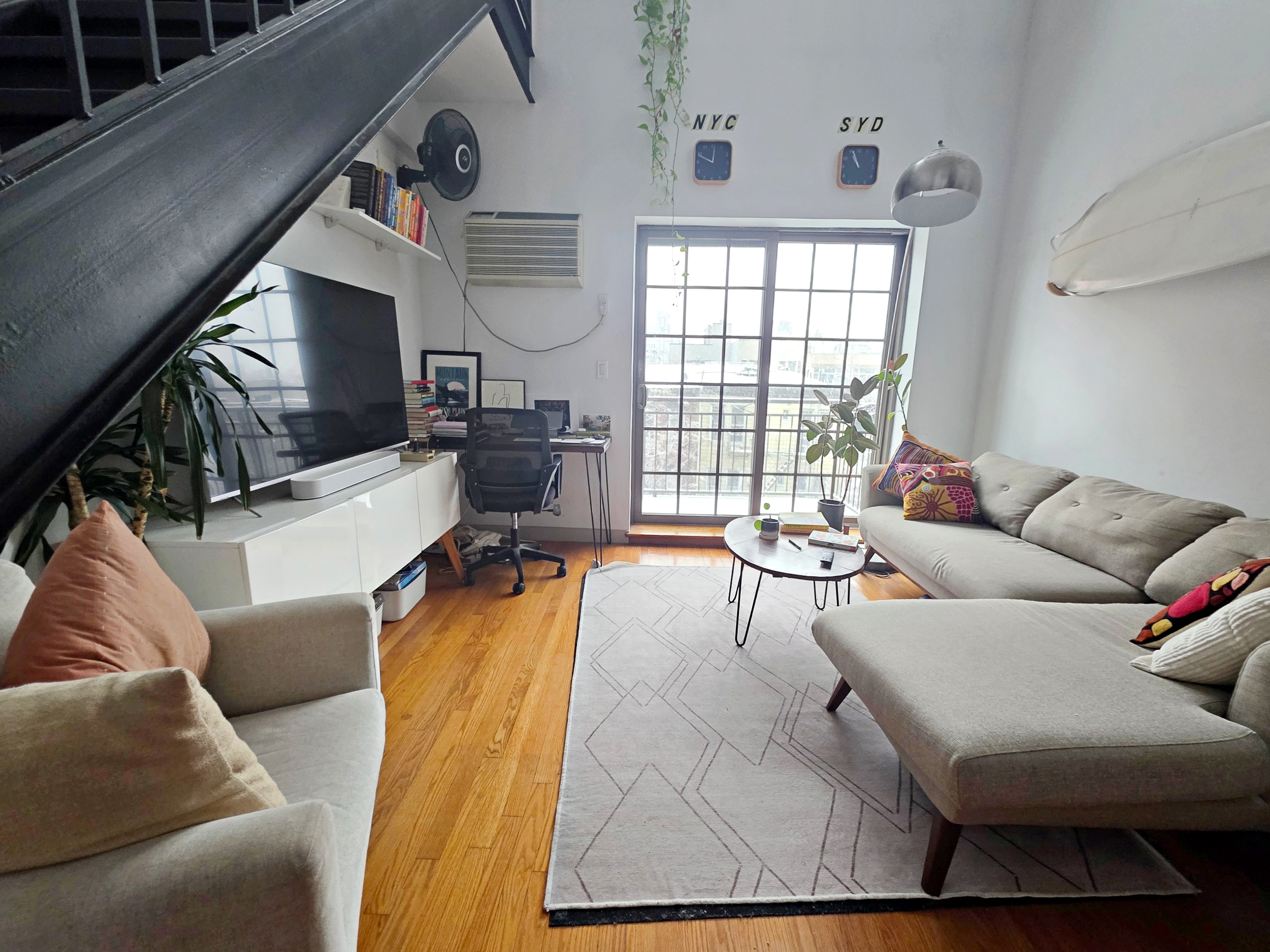 713 Metropolitan Avenue, Unit 4R Brooklyn, NY 11211 - Photo 3 of 11 a living room with furniture and a large window