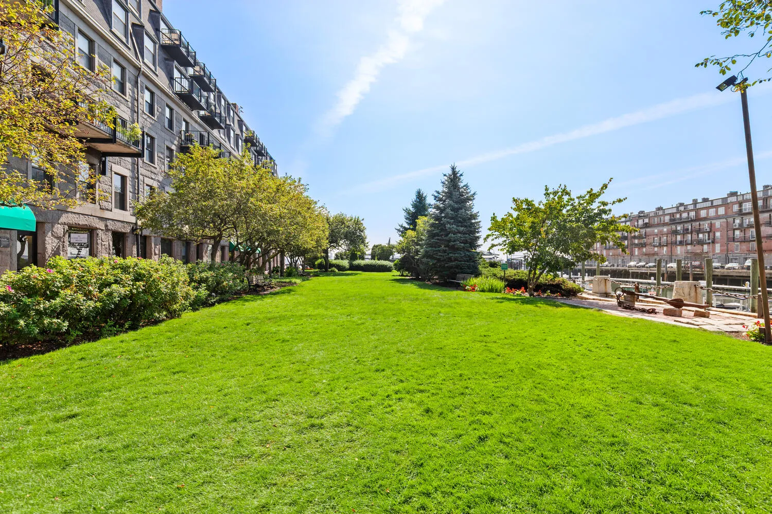 a view of a garden with a building in the background