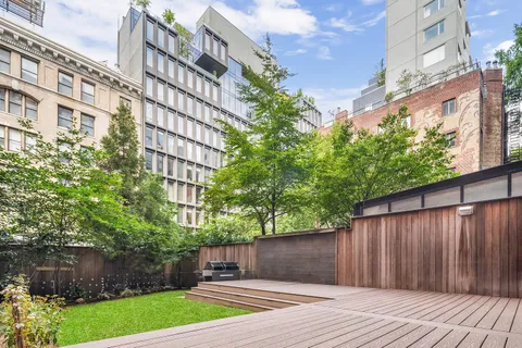 a house view with a garden space