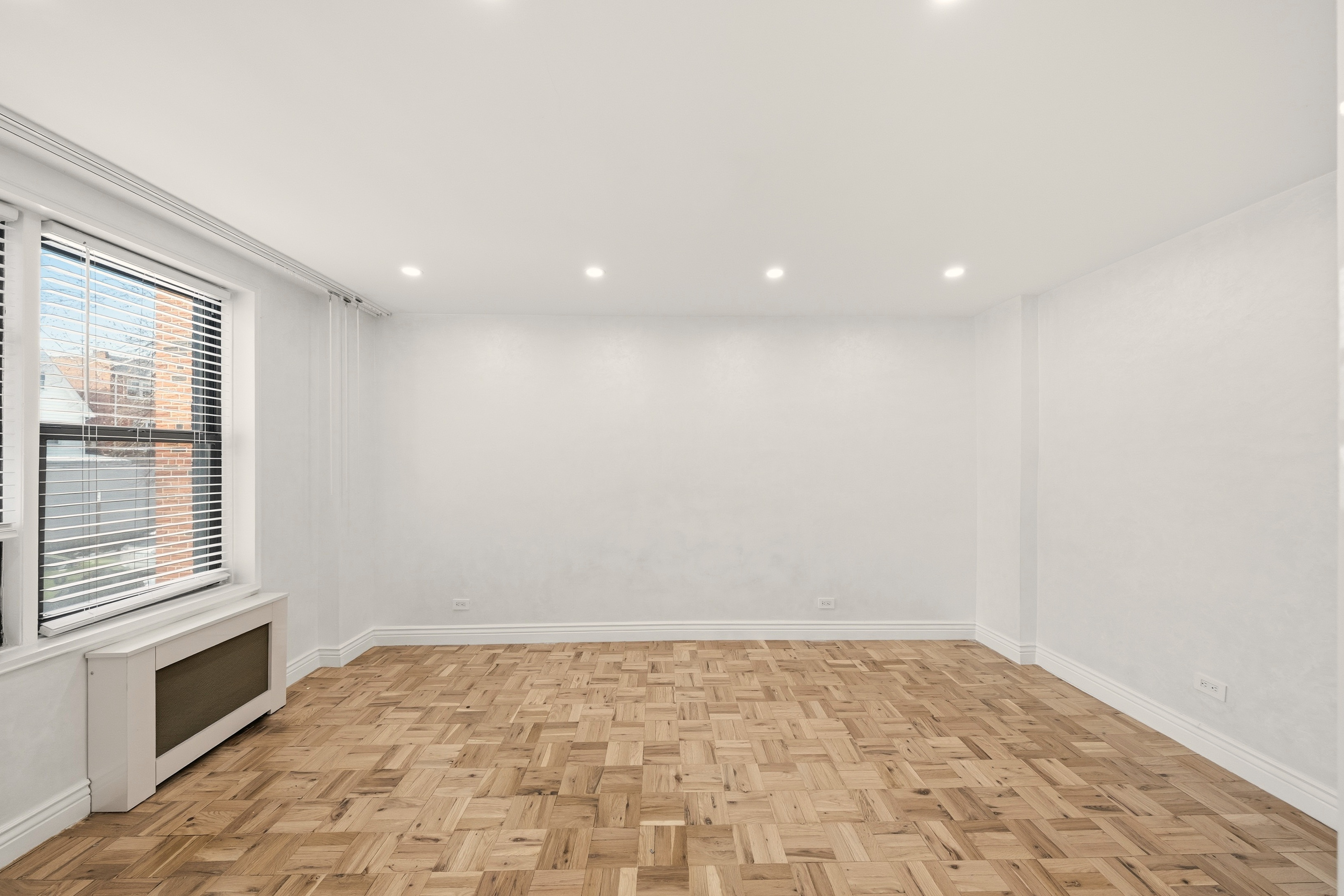 1577 East 17th Street, Unit 2F Brooklyn, NY 11230 - Photo 6 of 21 a view of an empty room and a window