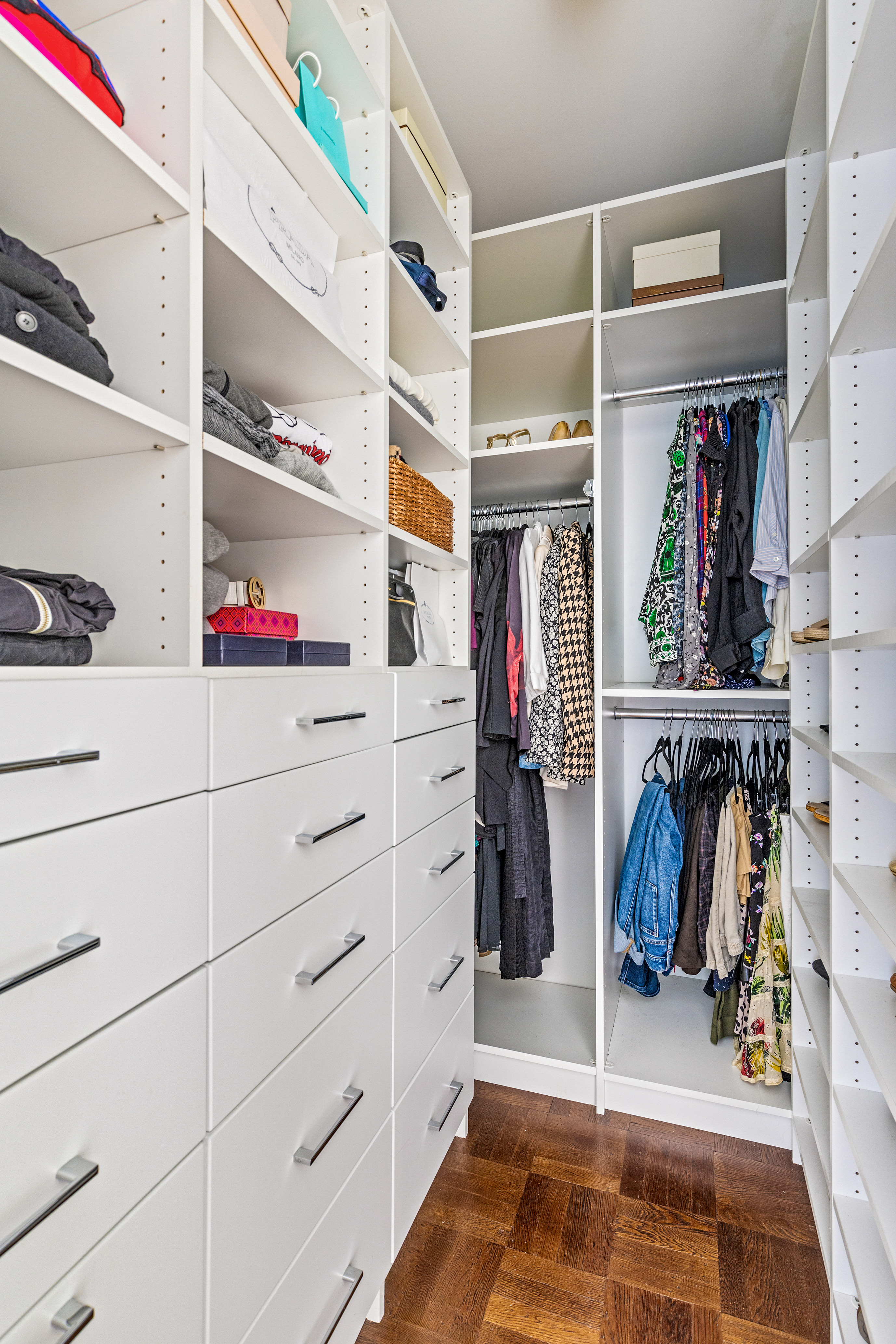 689 East 17th Street Brooklyn, NY 11230 - Photo 18 of 28 a view of walk in closet with clothes and shoes