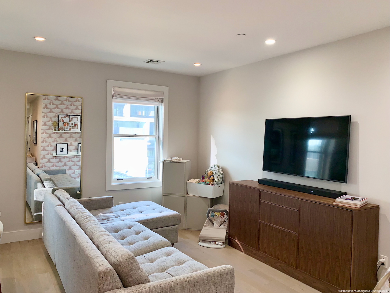 139-141 West 126th Street, Unit 4B Manhattan, NY 10027 - Photo 5 of 13 a living room with furniture and a flat screen tv