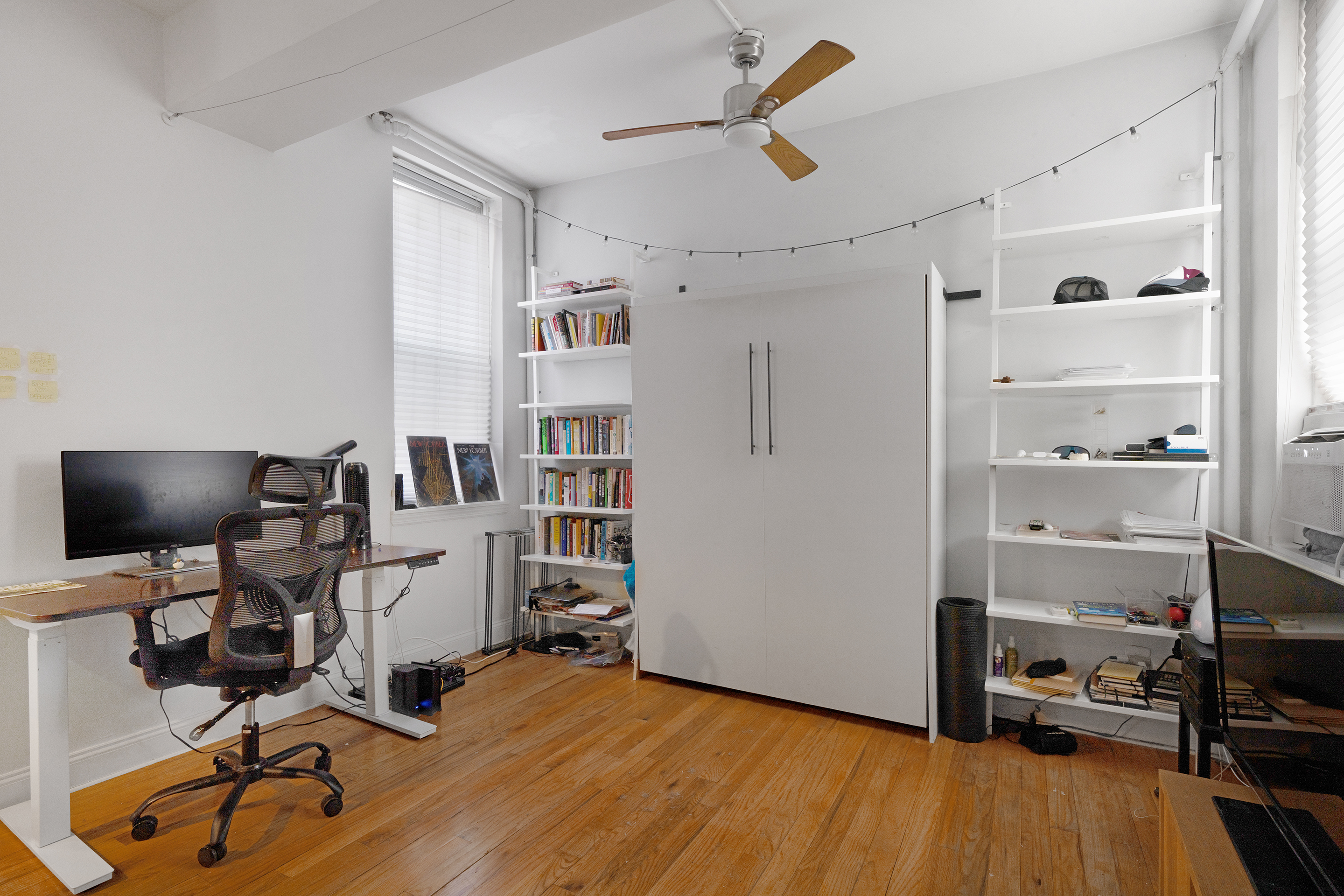 439 Hicks Street, Unit 1B Brooklyn, NY 11201 - Photo 5 of 7 a view of a workspace with furniture and a ceiling fan