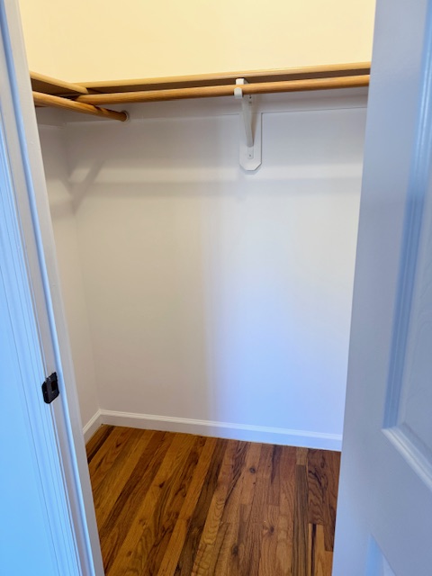 30-18 33rd Street, Unit 2F Queens, NY 11102 - Photo 5 of 6 a view of closet with wooden floor