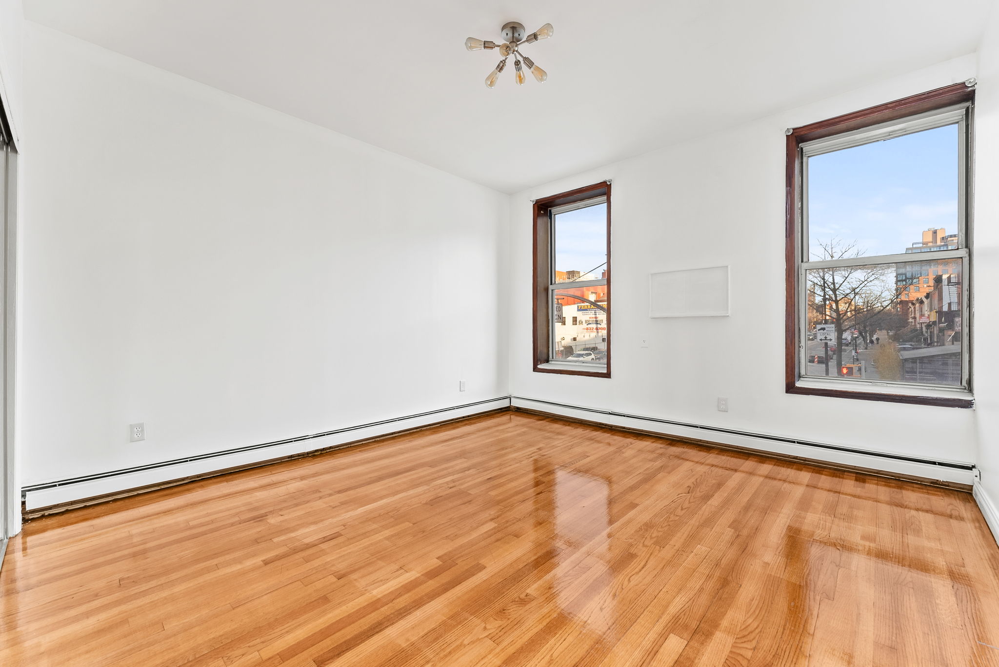 462 3rd Avenue, Unit 2 Brooklyn, NY 11215 - Photo 3 of 8 a view of an empty room with a window