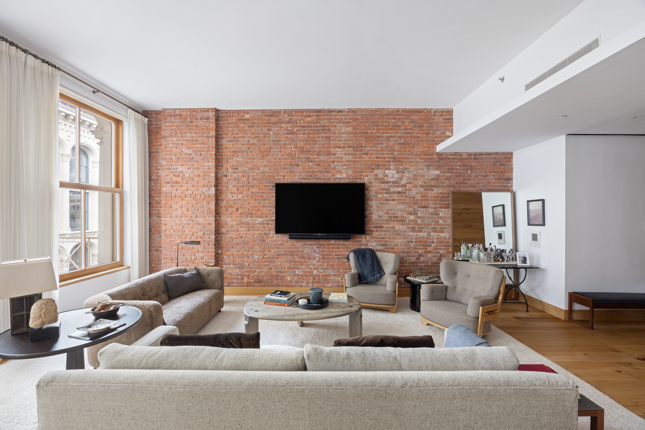60 White Street, Unit 4E Manhattan, NY 10013 - Photo 2 of 19 a living room with furniture wooden floor and a flat screen tv