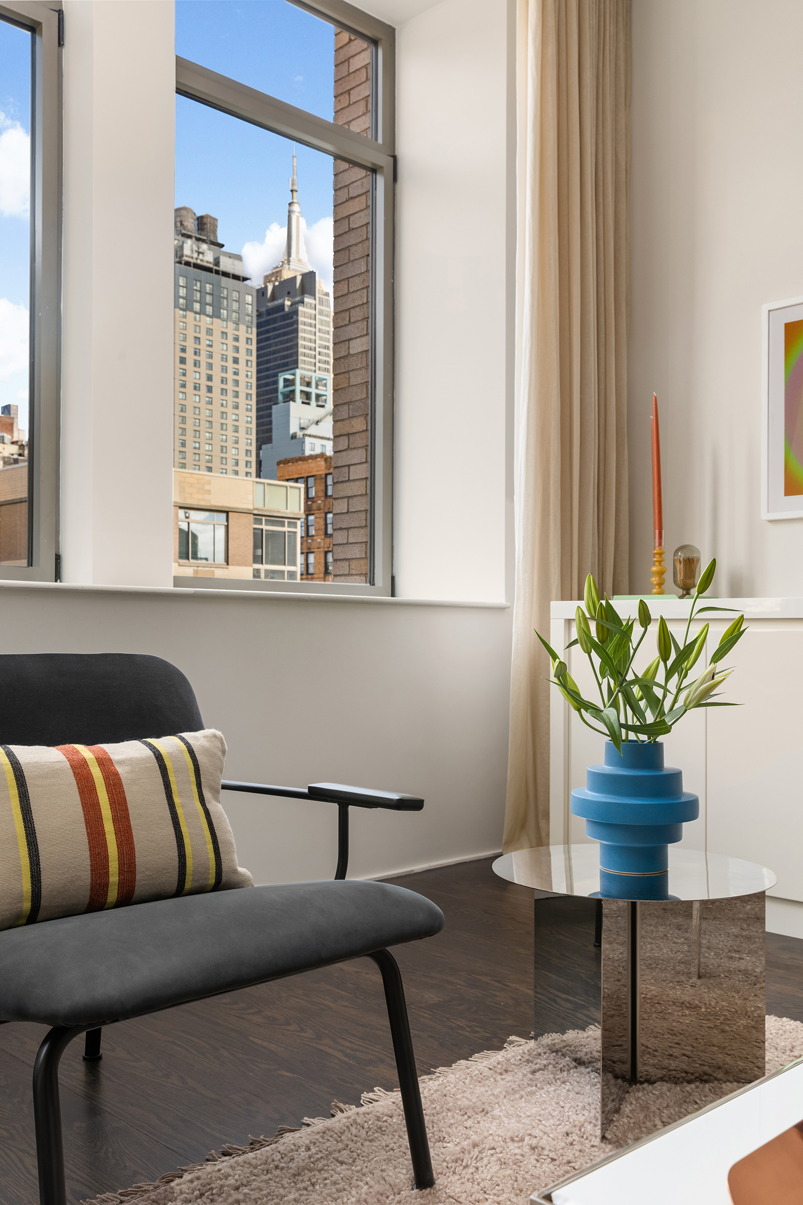 252 7th Avenue, Unit 14G Manhattan, NY 10001 - Photo 4 of 20 a living room with furniture