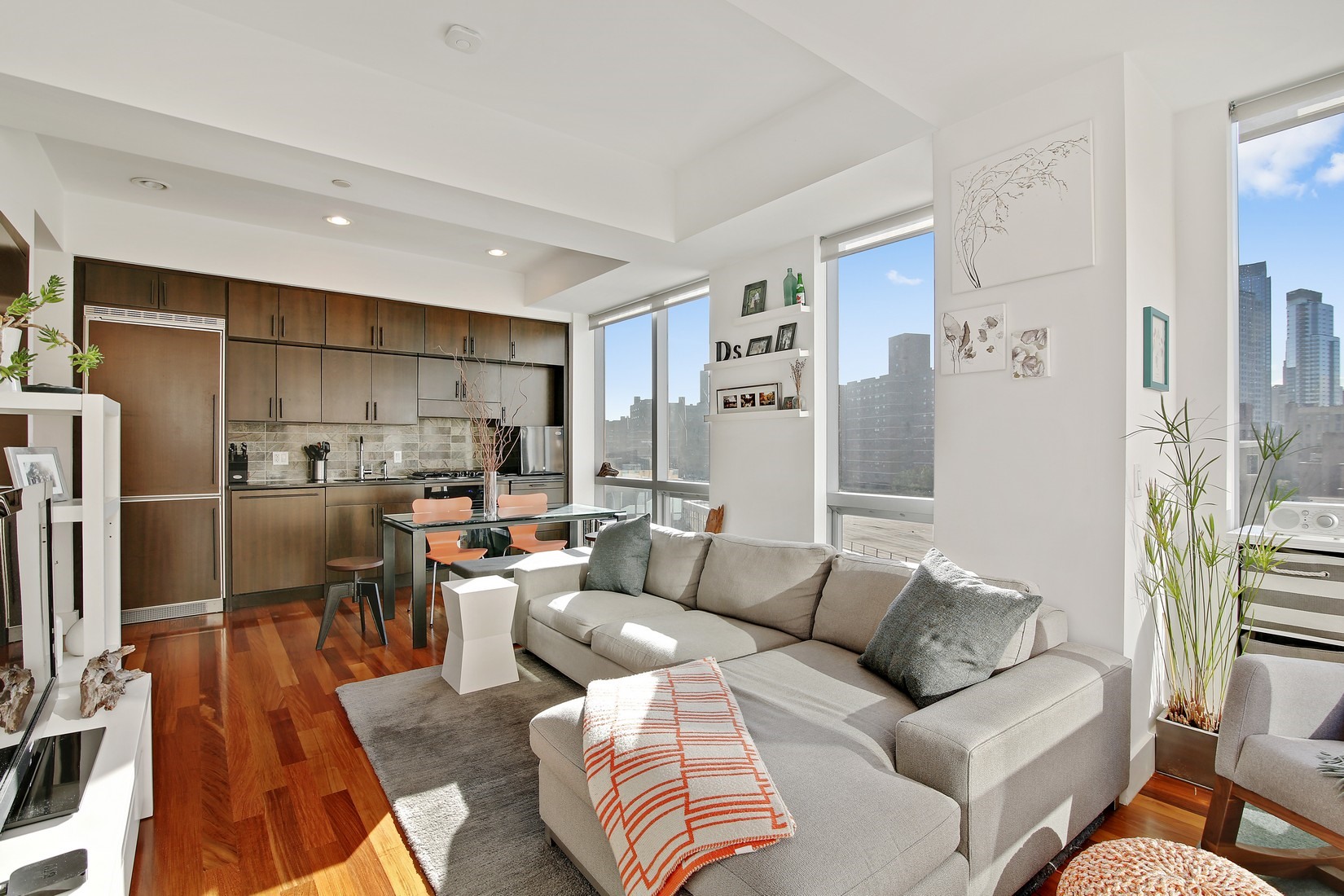 150 Myrtle Avenue, Unit 806 Brooklyn, NY 11201 - Photo 2 of 22 a living room with furniture kitchen view and a refrigerator