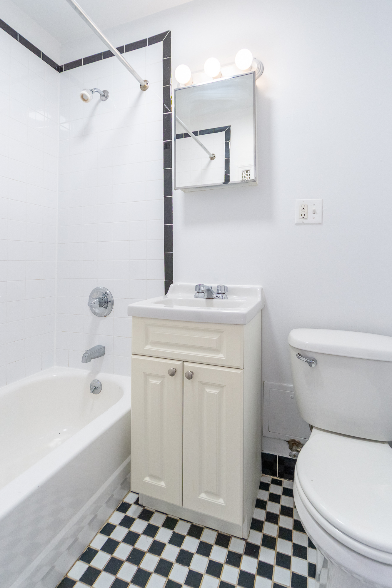 320 West 20th Street, Unit 9 Manhattan, NY 10011 - Photo 5 of 13 a bathroom with a sink toilet and shower
