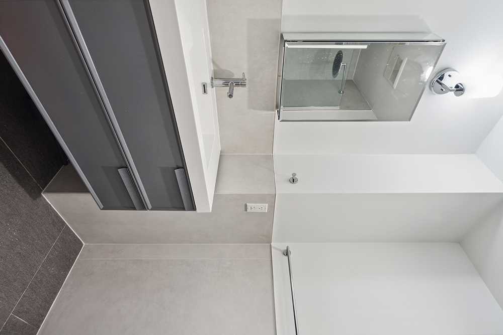 143 Winthrop Street, Unit 3C Brooklyn, NY 11225 - Photo 5 of 9 a bathroom with a sink and a mirror