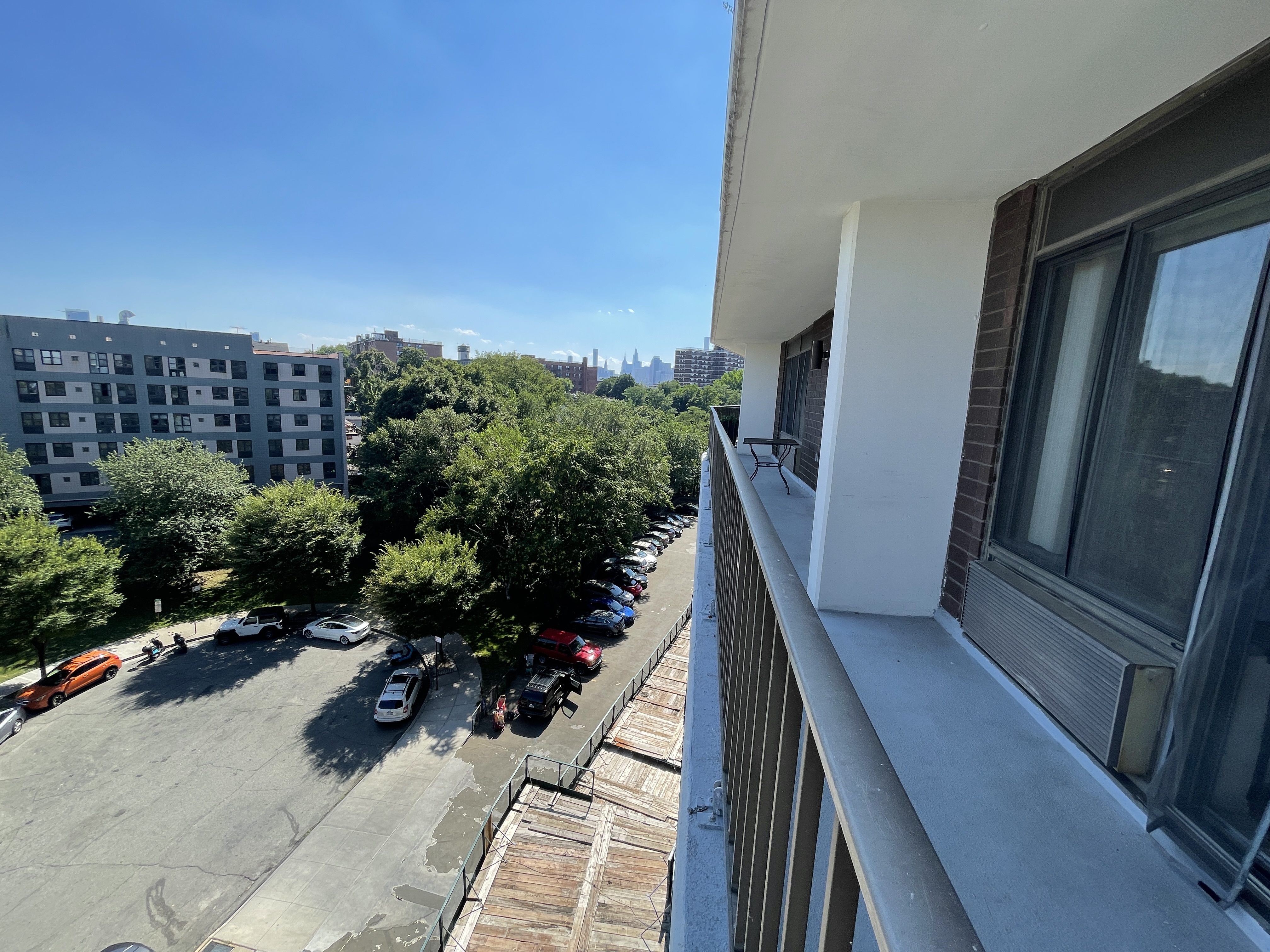 25-40 Shore Boulevard, Unit 6F Queens, NY 11102 - Photo 10 of 17 a view of balcony with wooden floor and outdoor space