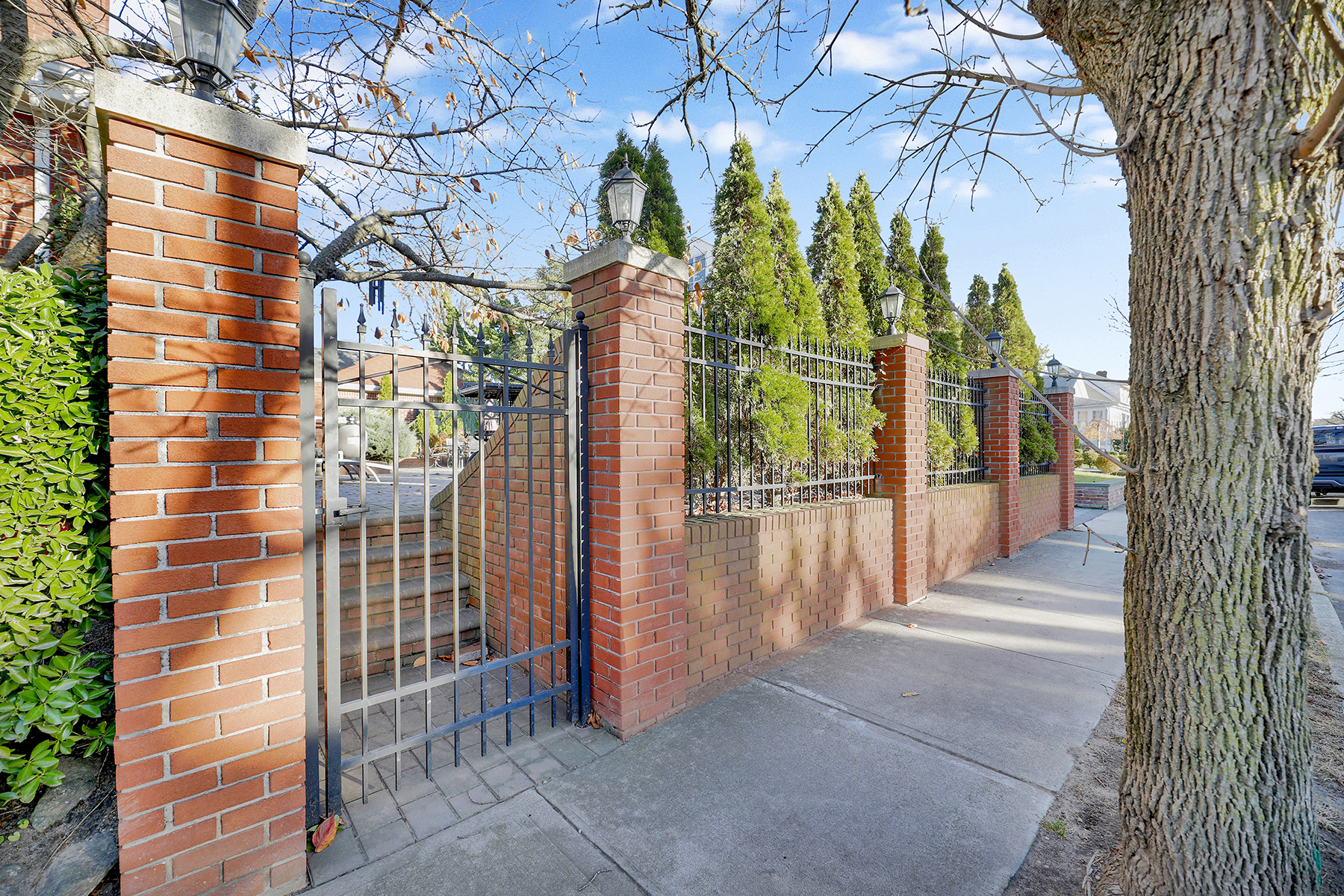 142-15 Newport Avenue Queens, NY 11694 - Photo 38 of 72 a view of a pathway of a house with a iron fence