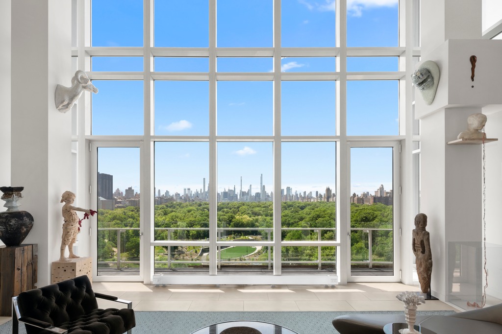 111 Central Park North, Unit PHB Manhattan, NY 10026 - Photo 4 of 17 a living room with a floor to ceiling window and floor to ceiling window