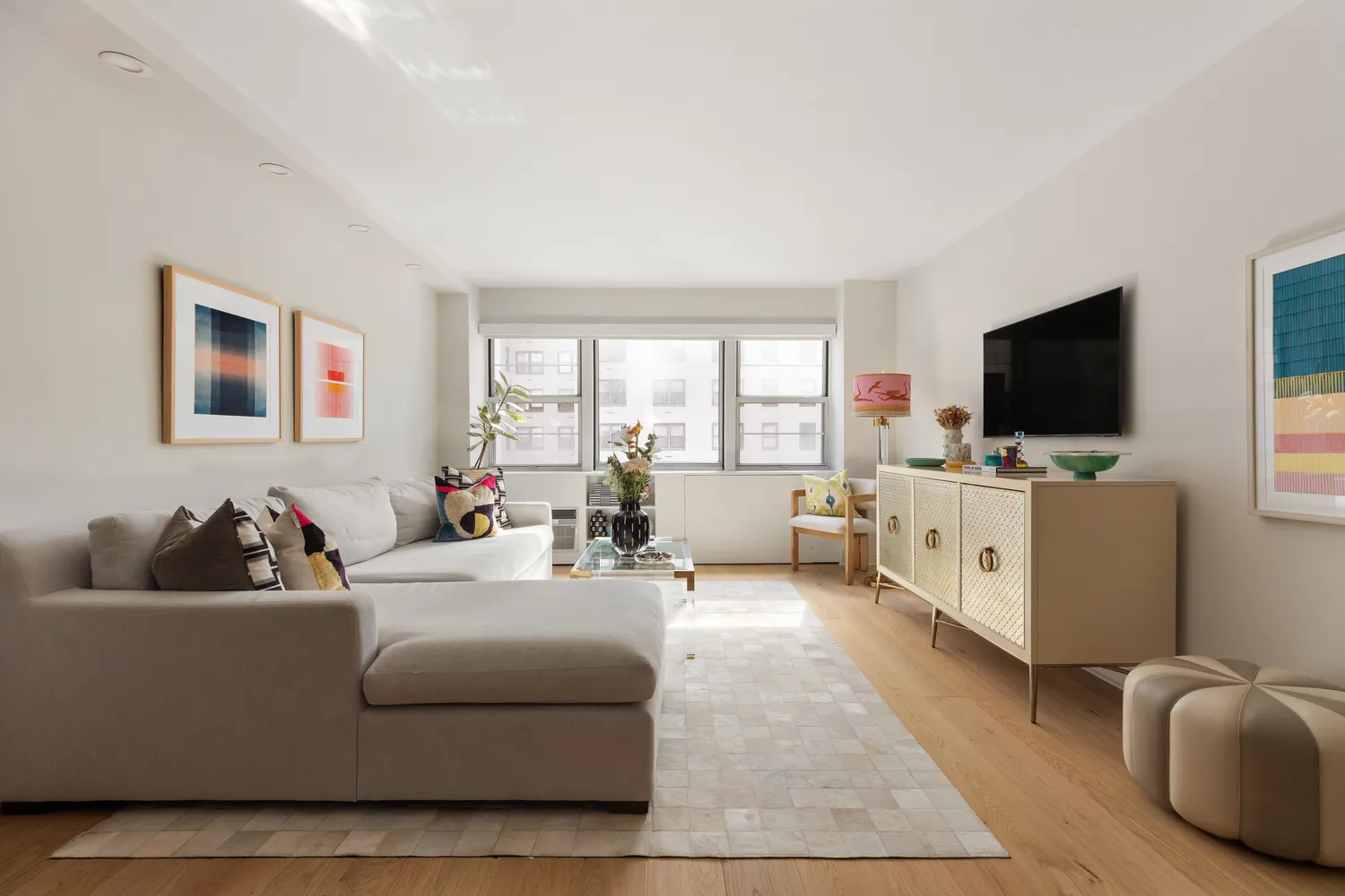 a living room with furniture and a flat screen tv