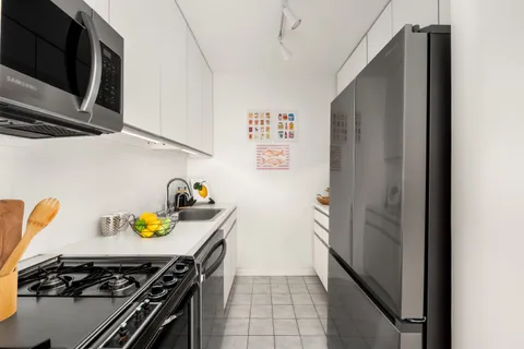 a kitchen with a stove and a refrigerator