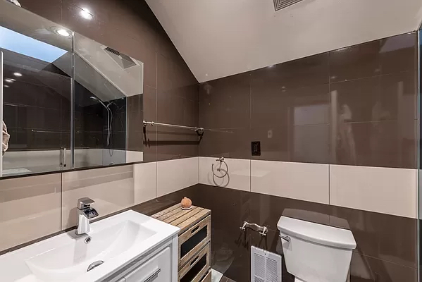 210 West 16th Street, Unit PH Manhattan, NY 10011 - Photo 8 of 16 a bathroom with a sink and a toilet