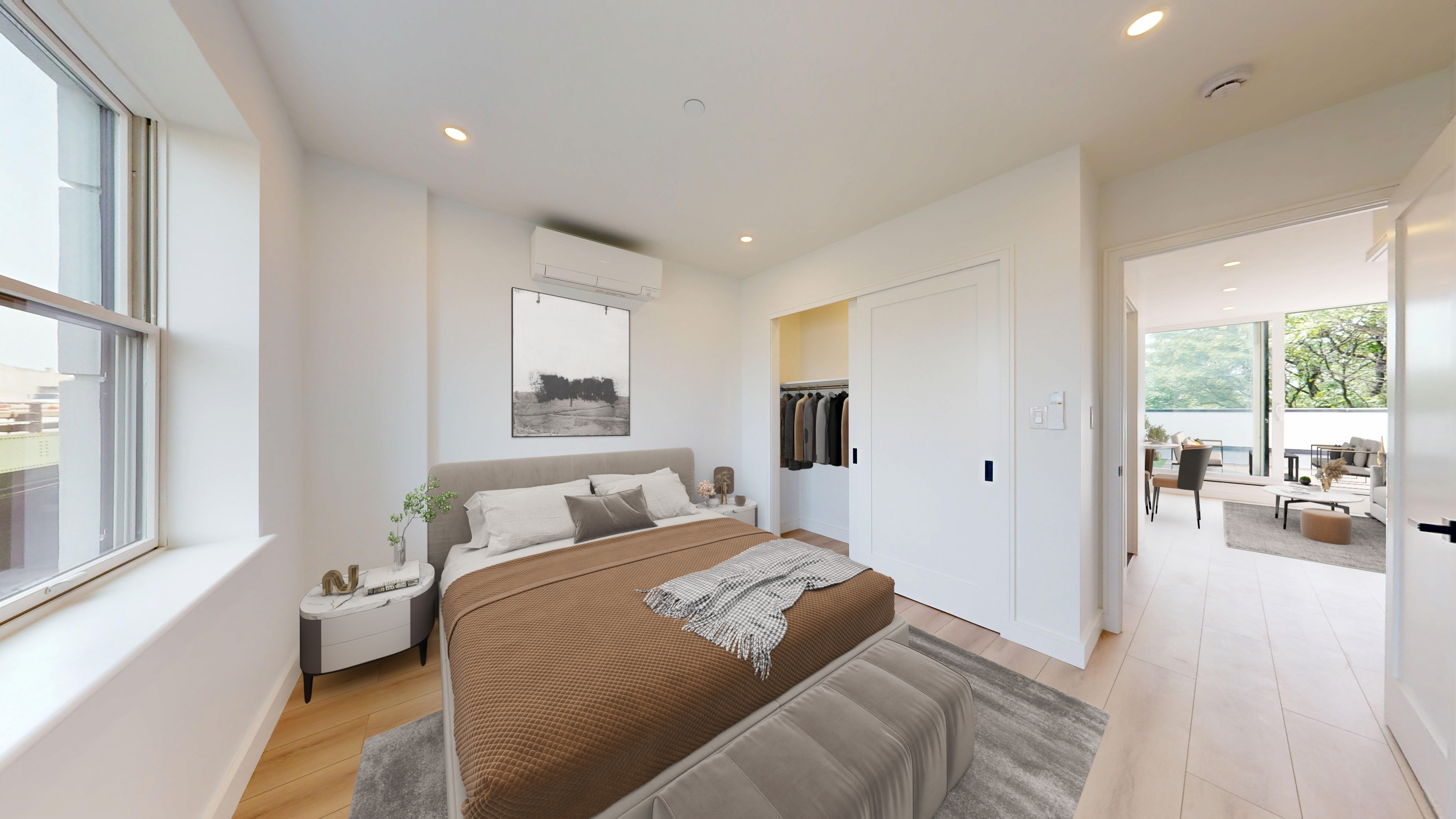 5614 3rd Avenue, Unit 3 Brooklyn, NY 11220 - Photo 4 of 11 a bedroom with a bed and a large window