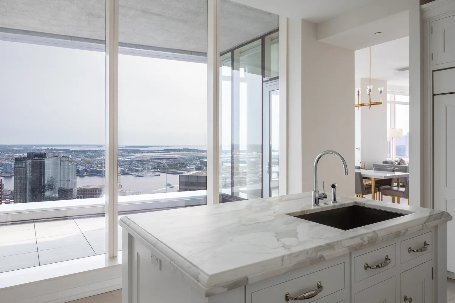 a kitchen with a large window and a sink
