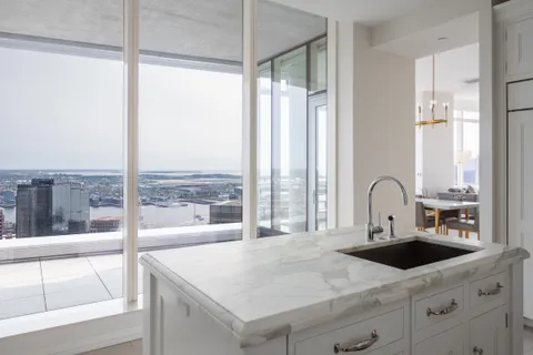 a kitchen with a large window and a sink