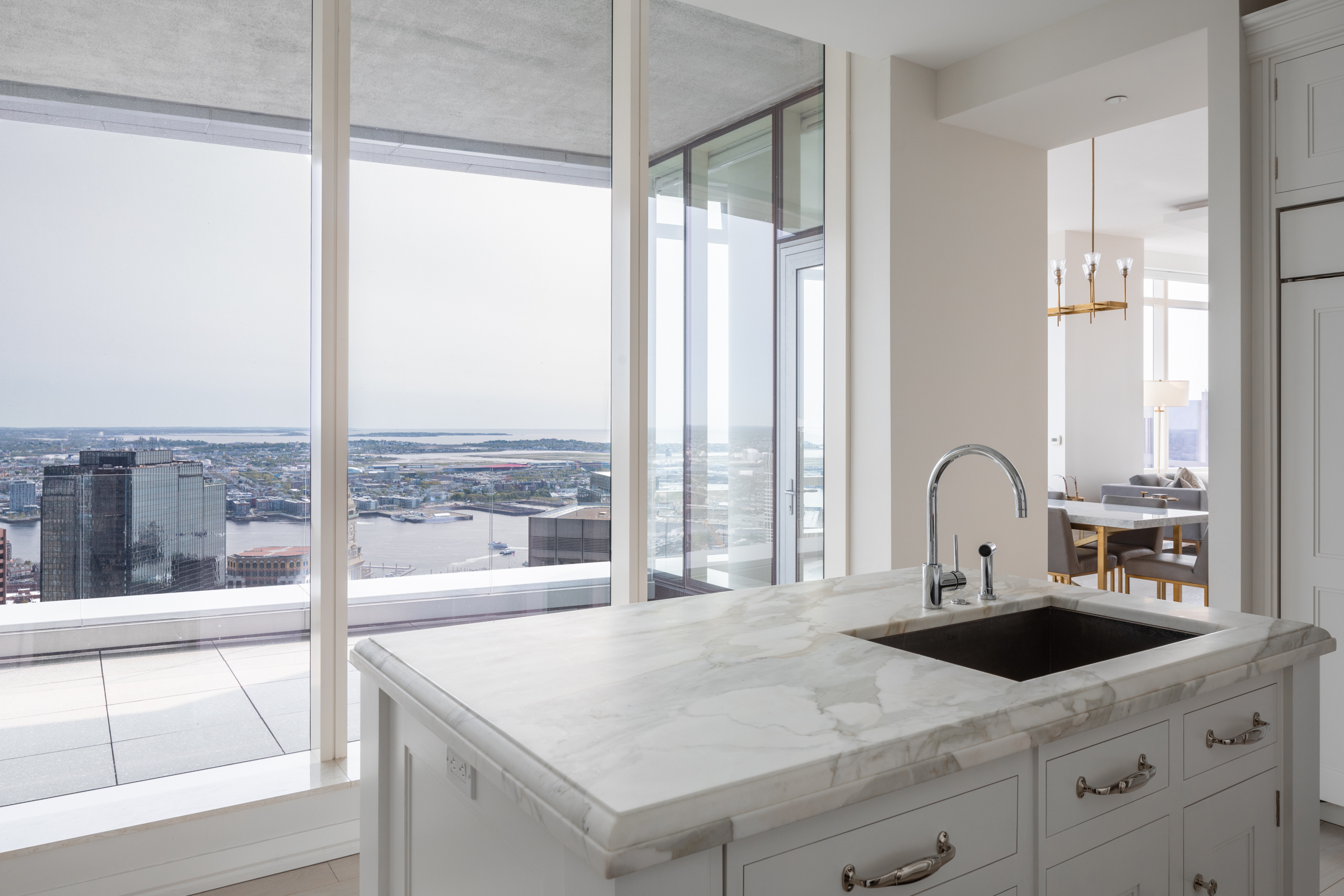 1 Franklin Street, Unit PH2D Boston, MA 02110 - Photo 11 of 26 a kitchen with a large window and a sink