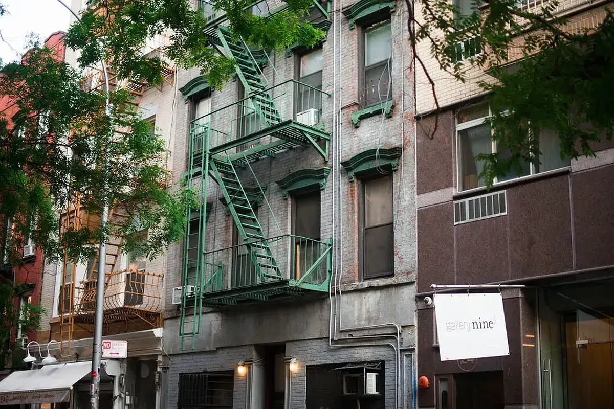 a view of a building with a tree
