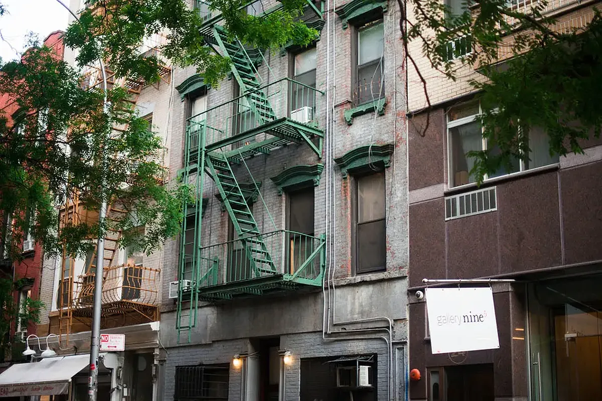 9 Spring Street, Unit 24 Manhattan, NY 10012 - Photo 6 of 8 a view of a building with a tree