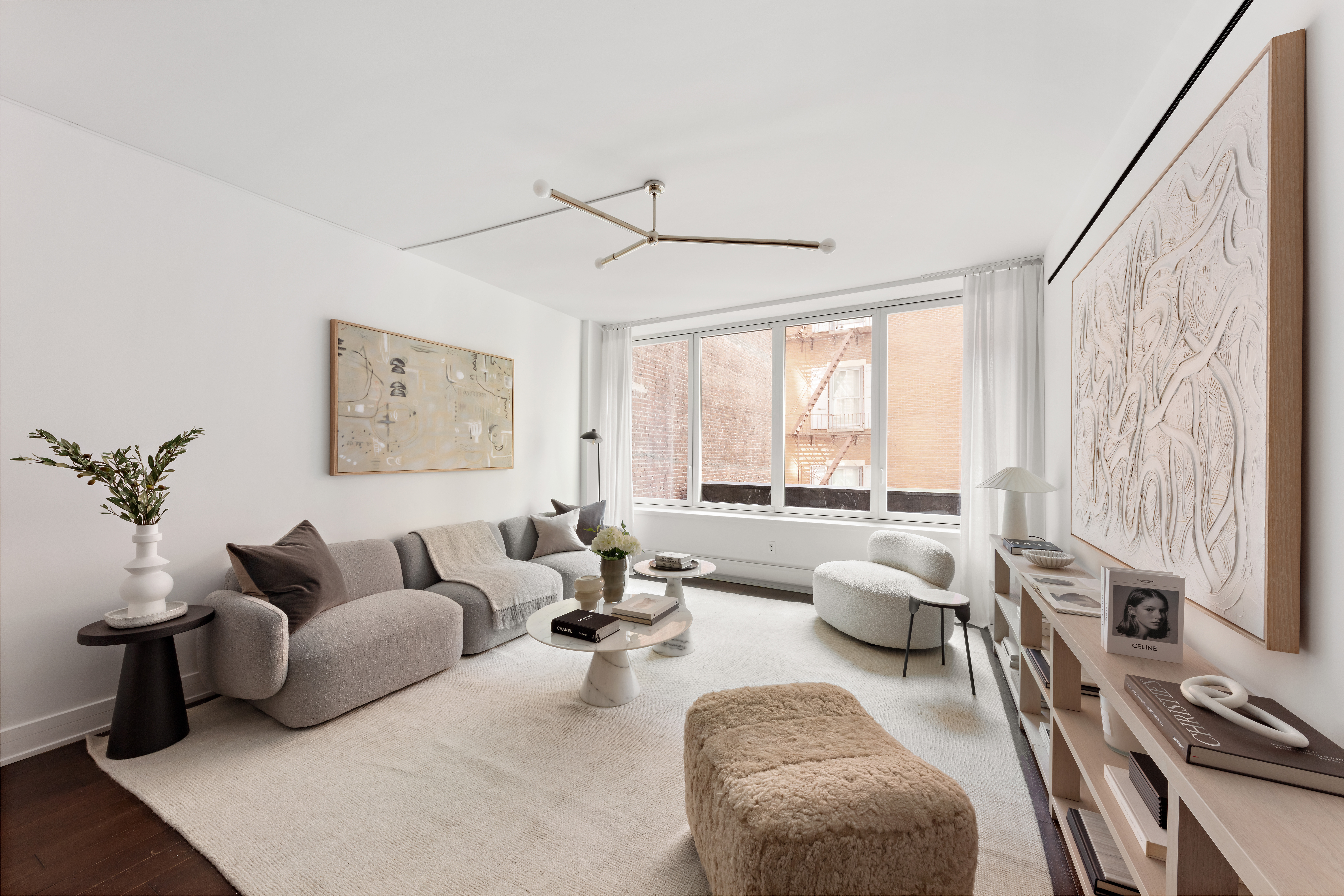 5 Franklin Place, Unit 3A Manhattan, NY 10013 - Photo 3 of 17 a living room with furniture and floor to ceiling windows