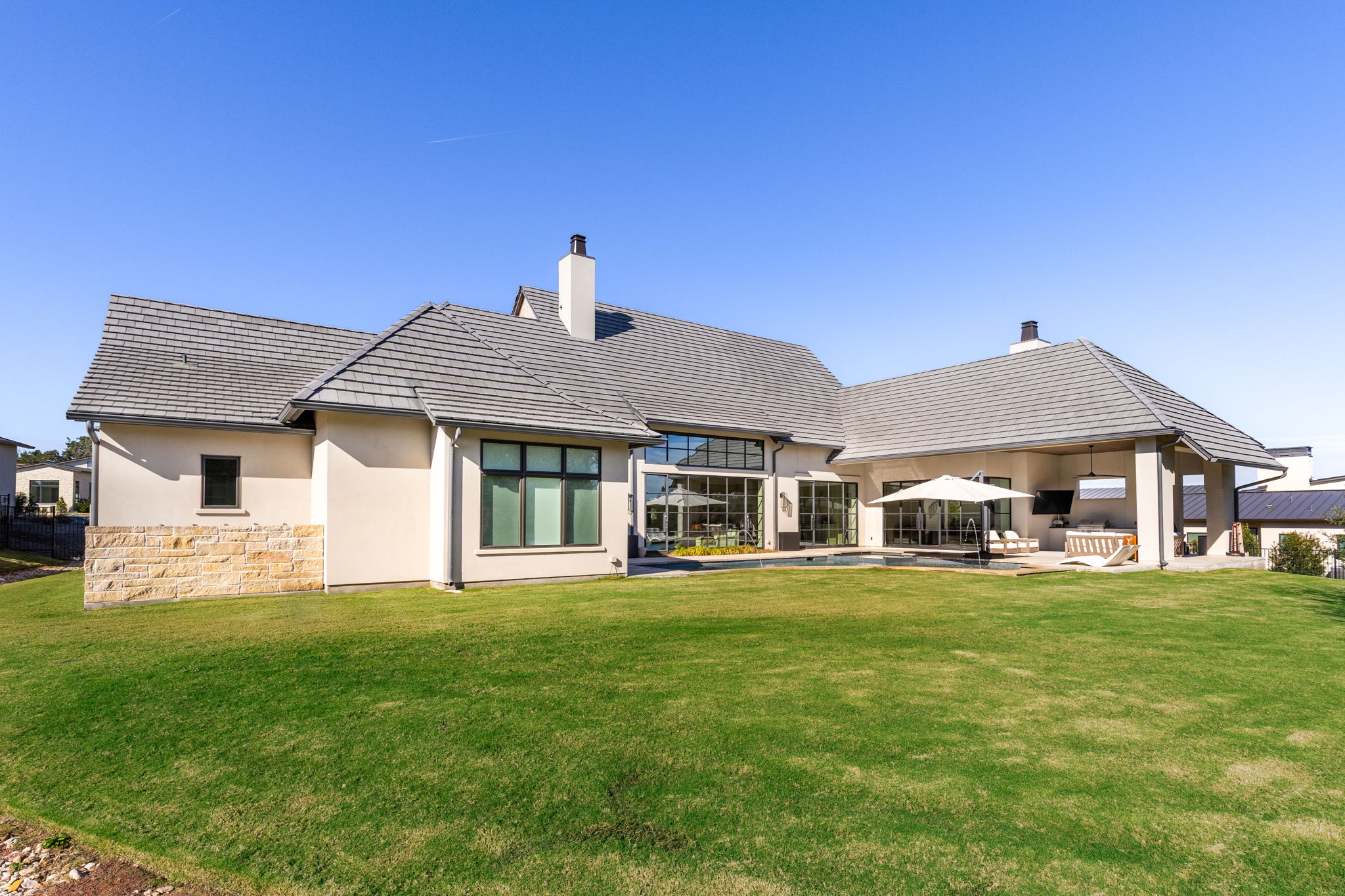 522 Delayne Drive Austin, TX 78737 - Photo 11 of 23 a front view of a house with a yard table and chairs