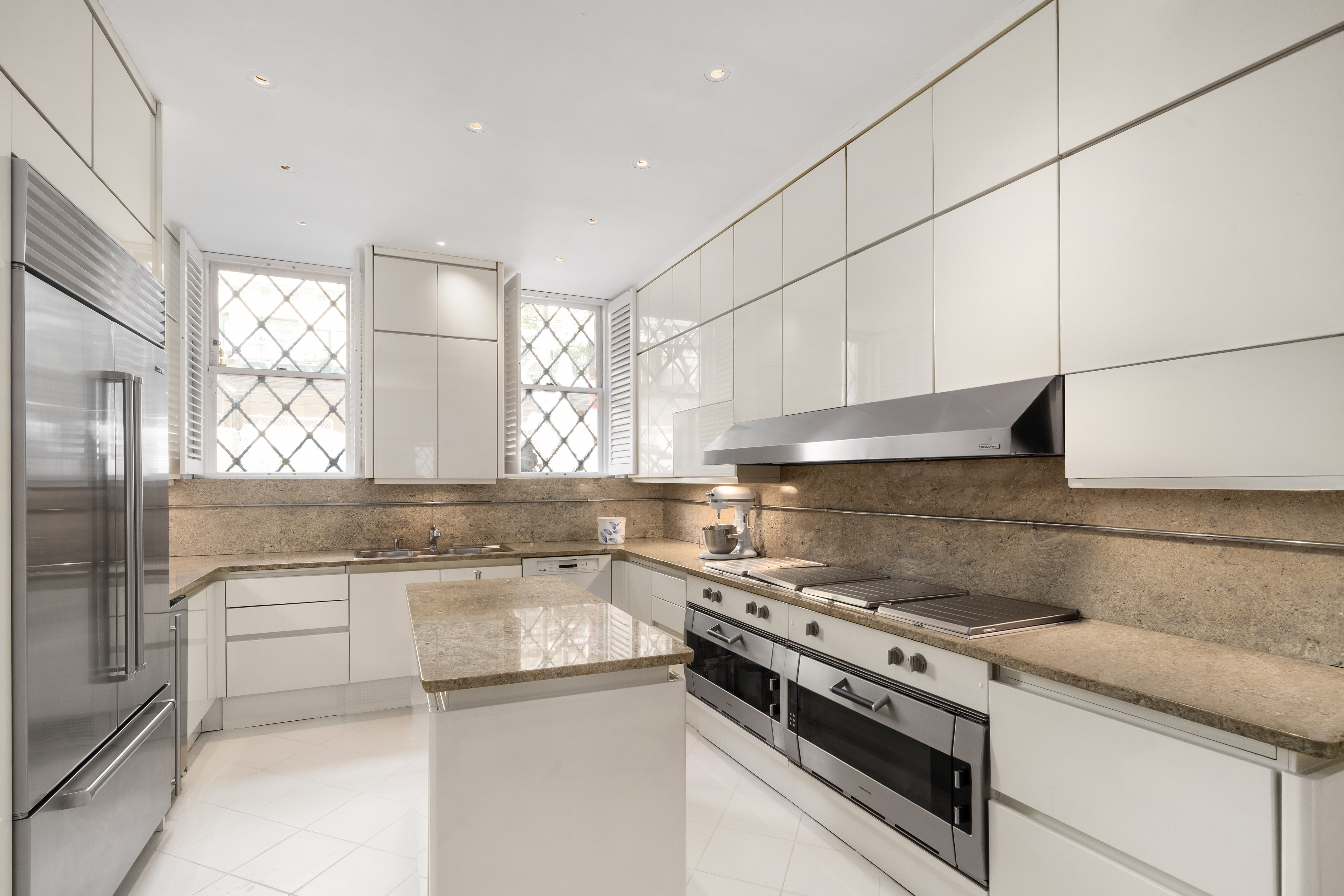 46 East 71st Street Manhattan, NY 10021 - Photo 8 of 27 a kitchen with a stove and a sink