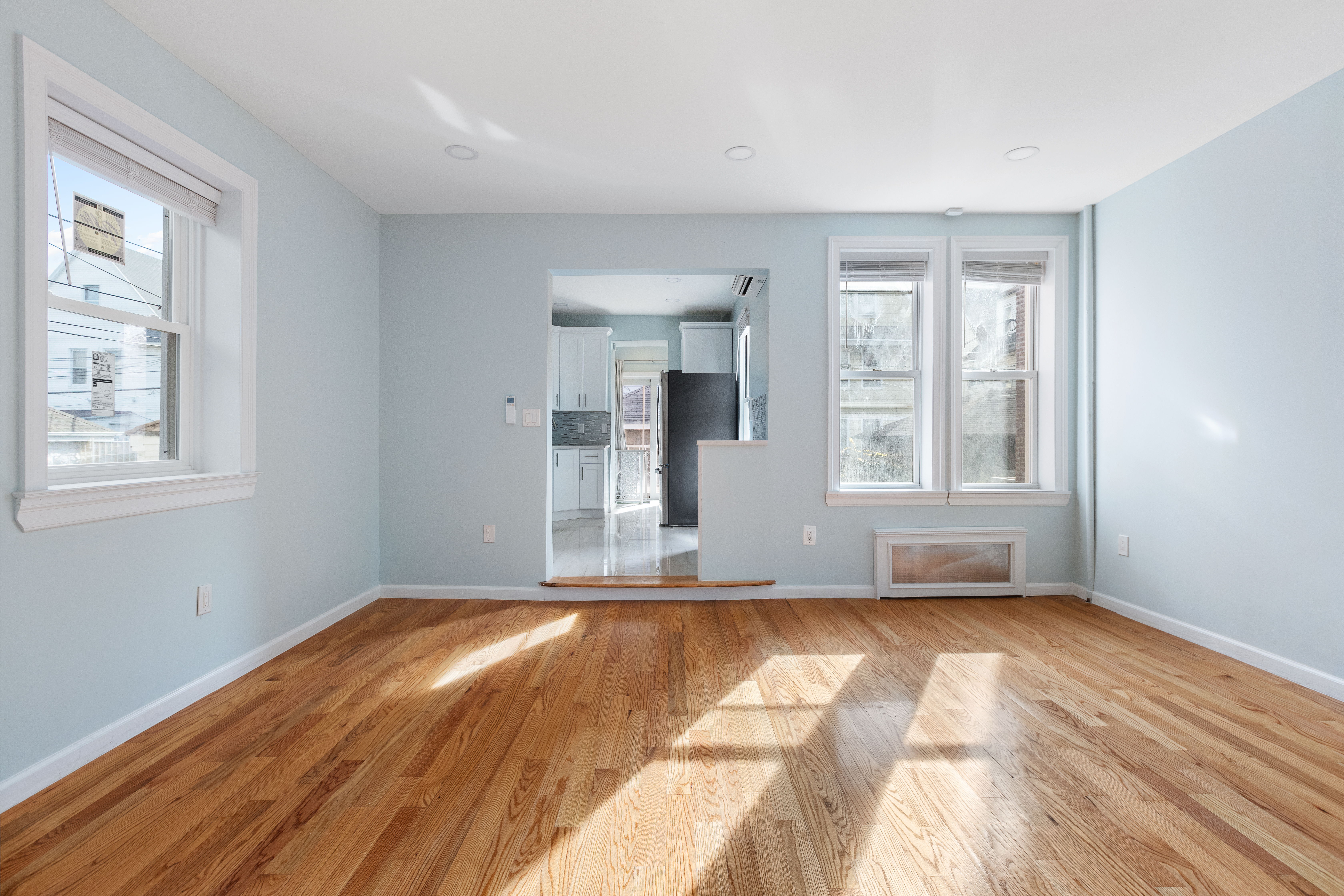 2773 Bedford Avenue Brooklyn, NY 11210 - Photo 6 of 17 a view of empty room with wooden floor and fan