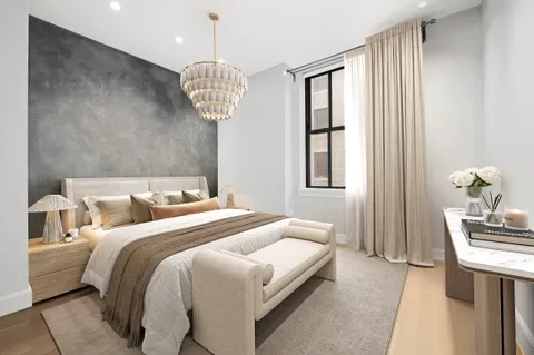 a bedroom with bed and a window