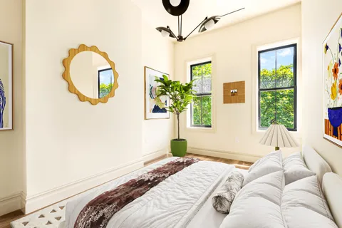 a bedroom with a bed and a window