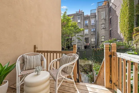 a view of balcony with furniture