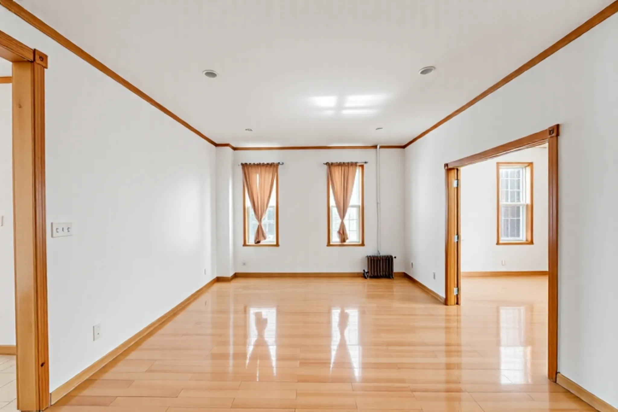 1759 West 1st Street Brooklyn, NY 11223 - Photo 6 of 21 a view of an empty room with glass door and windows