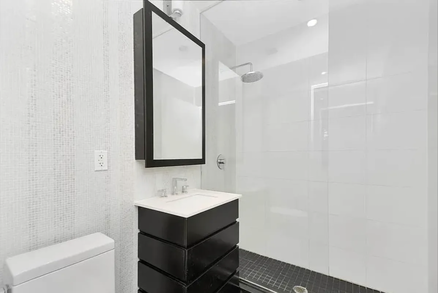 65 North 6th Street, Unit 3D Brooklyn, NY 11249 - Photo 5 of 7 a bathroom with a sink toilet and mirror