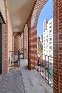 a view of a balcony with chairs
