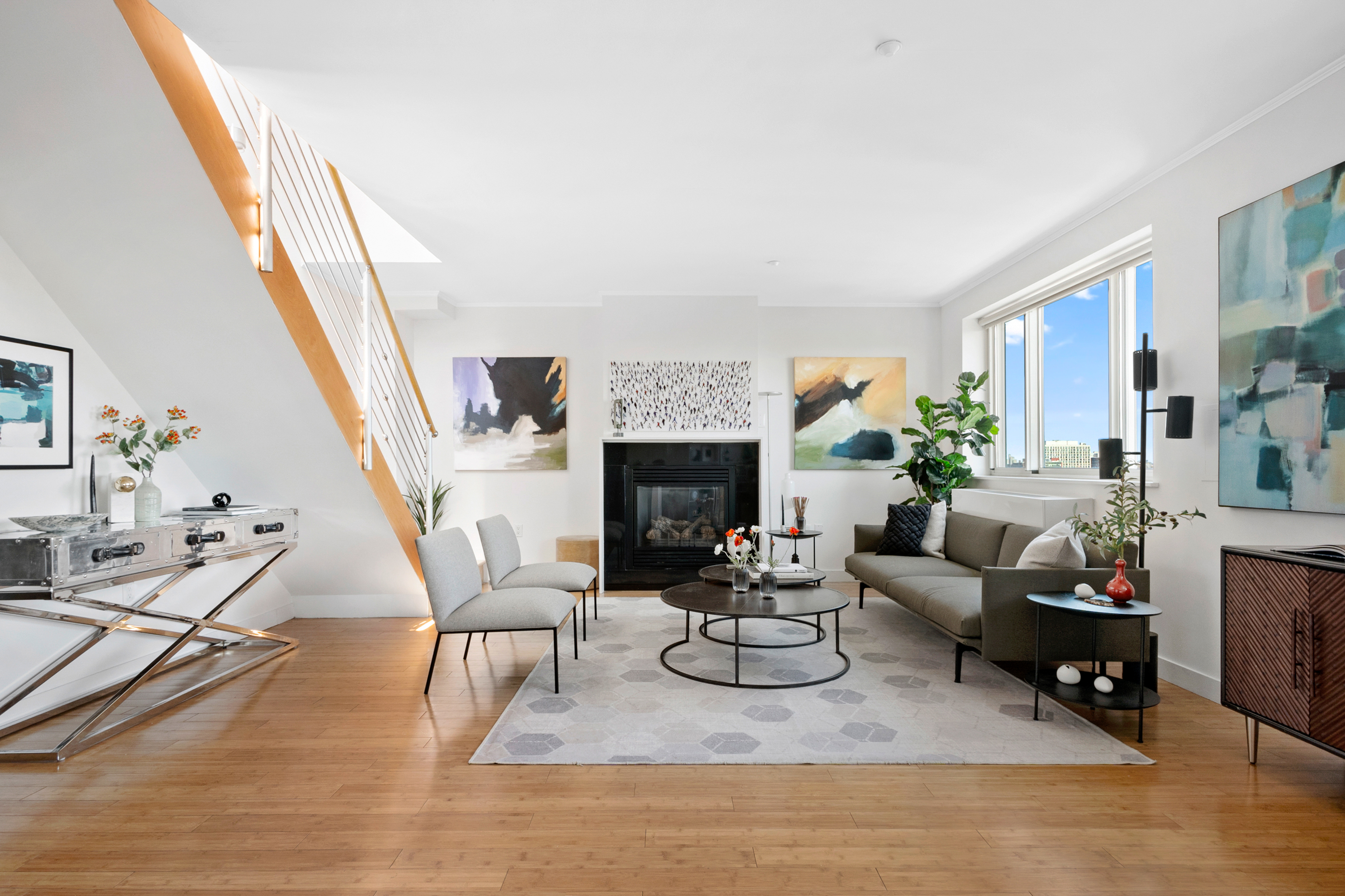 301 West 115th Street, Unit PH4C Manhattan, NY 10026 - Photo 2 of 15 a living room with furniture and a fireplace