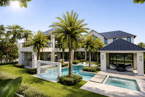 a view of a house with swimming pool and sitting area