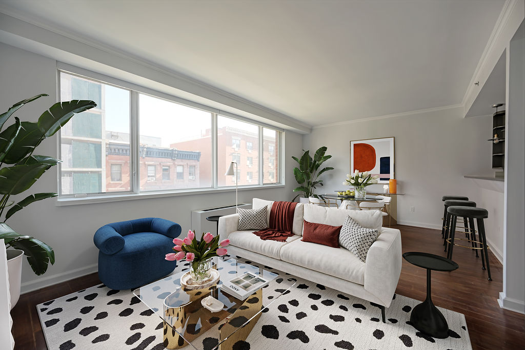 a living room with furniture and a window