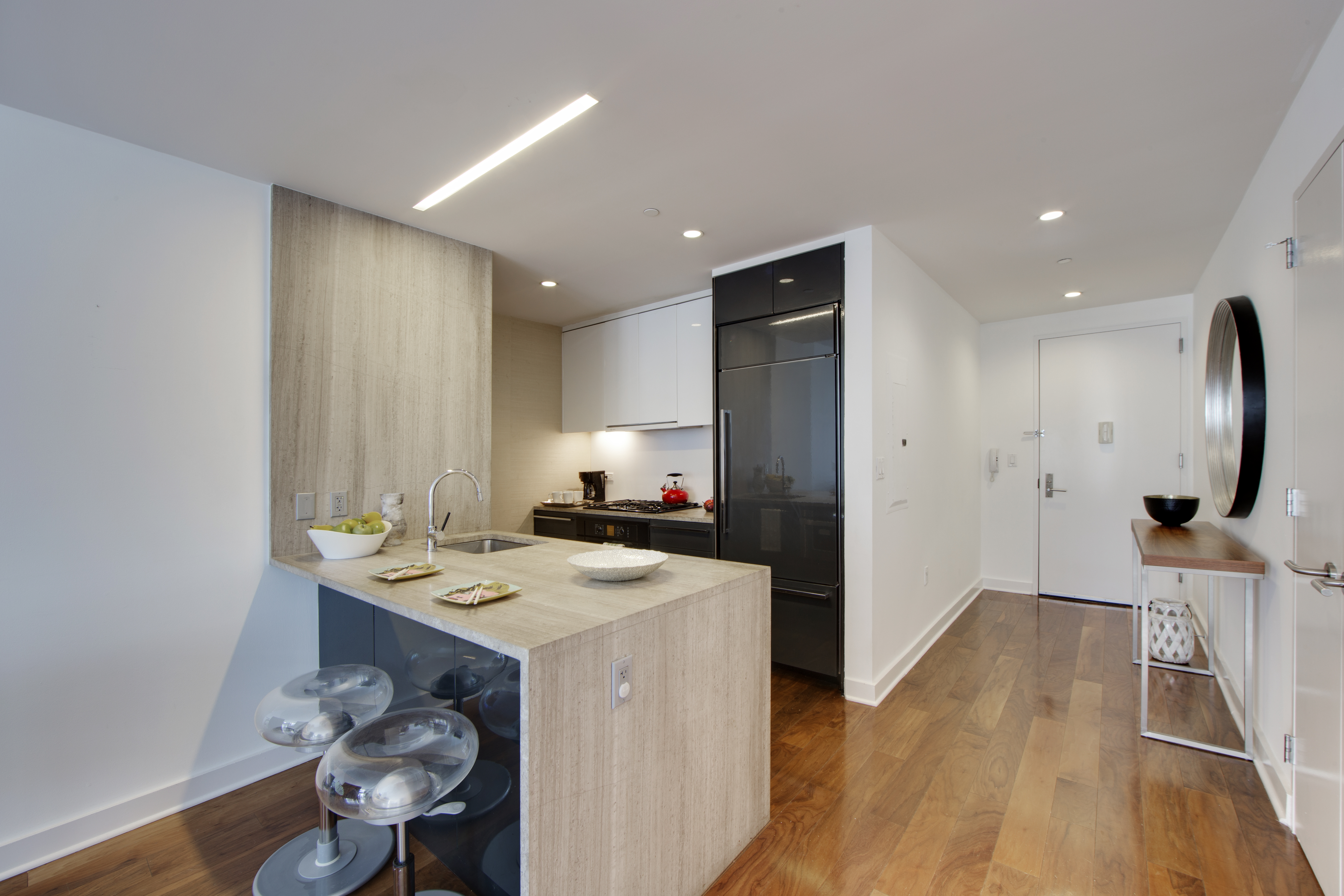 2 Northside Piers, Unit 8H Brooklyn, NY 11249 - Photo 8 of 20 a view of kitchen island wooden floor