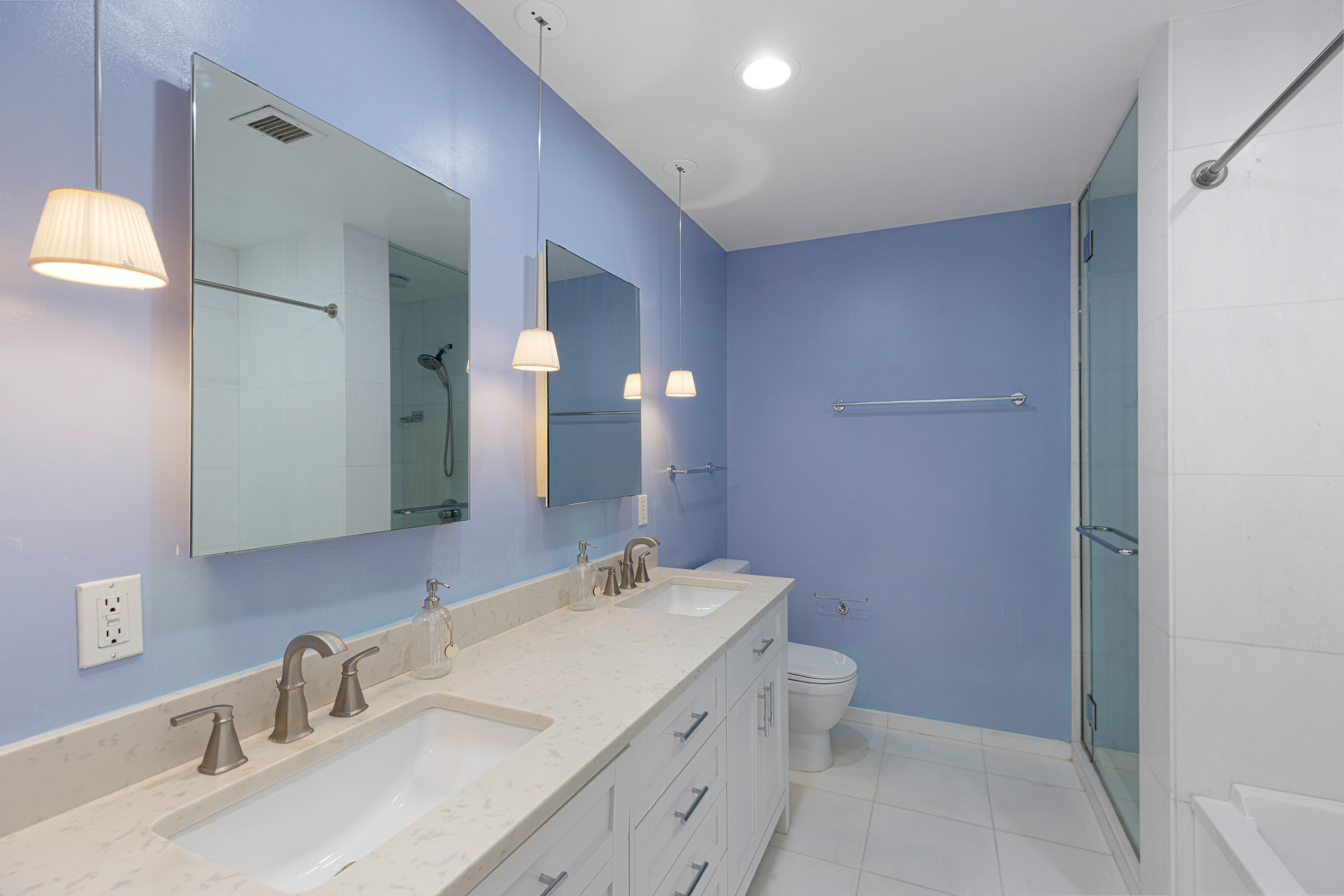 15 Broad Street, Unit 2300 Manhattan, NY 10005 - Photo 10 of 36 a bathroom with a sink and a mirror