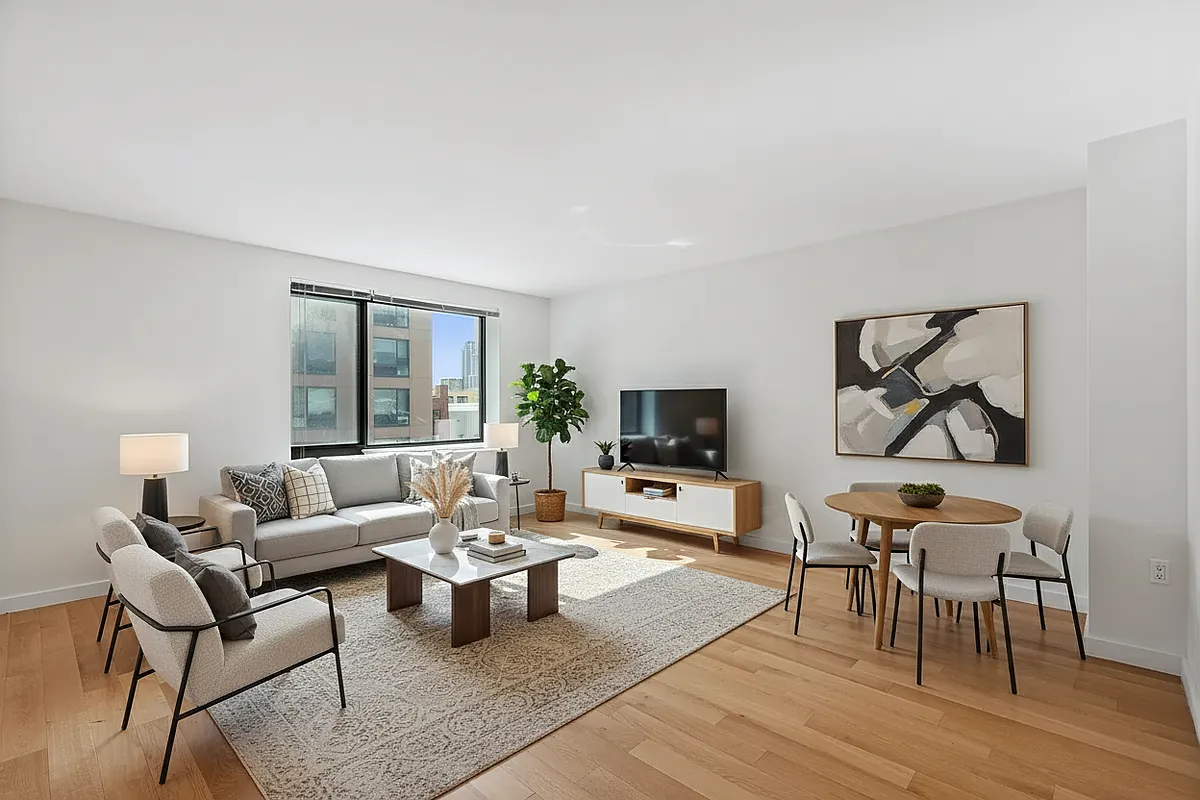 44-72 11th Street, Unit B302 Queens, NY 11101 - Photo 1 of 12 a living room with furniture and a flat screen tv