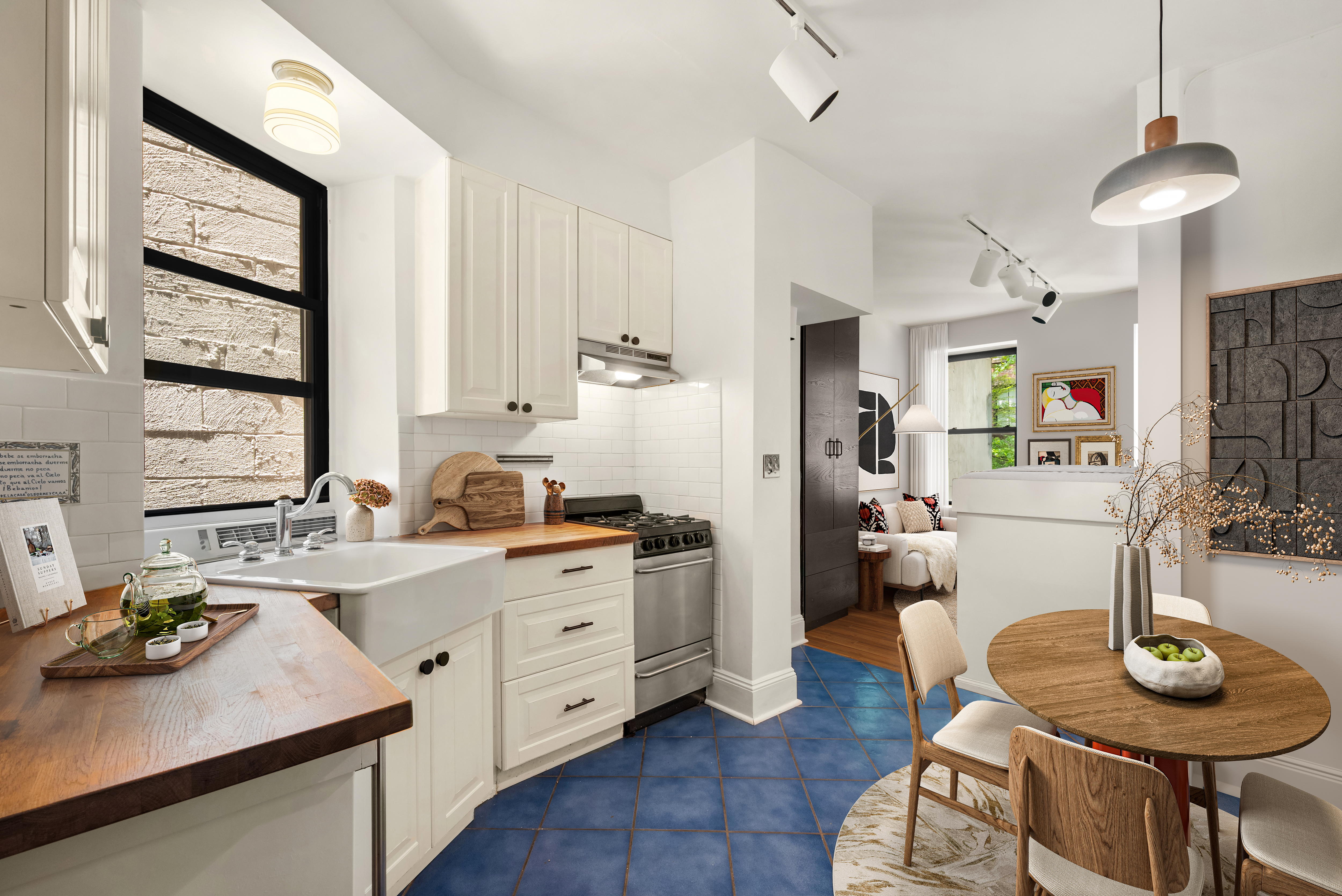 41 Perry Street, Unit 2A Manhattan, NY 10014 - Photo 3 of 12 a kitchen with sink refrigerator and stove