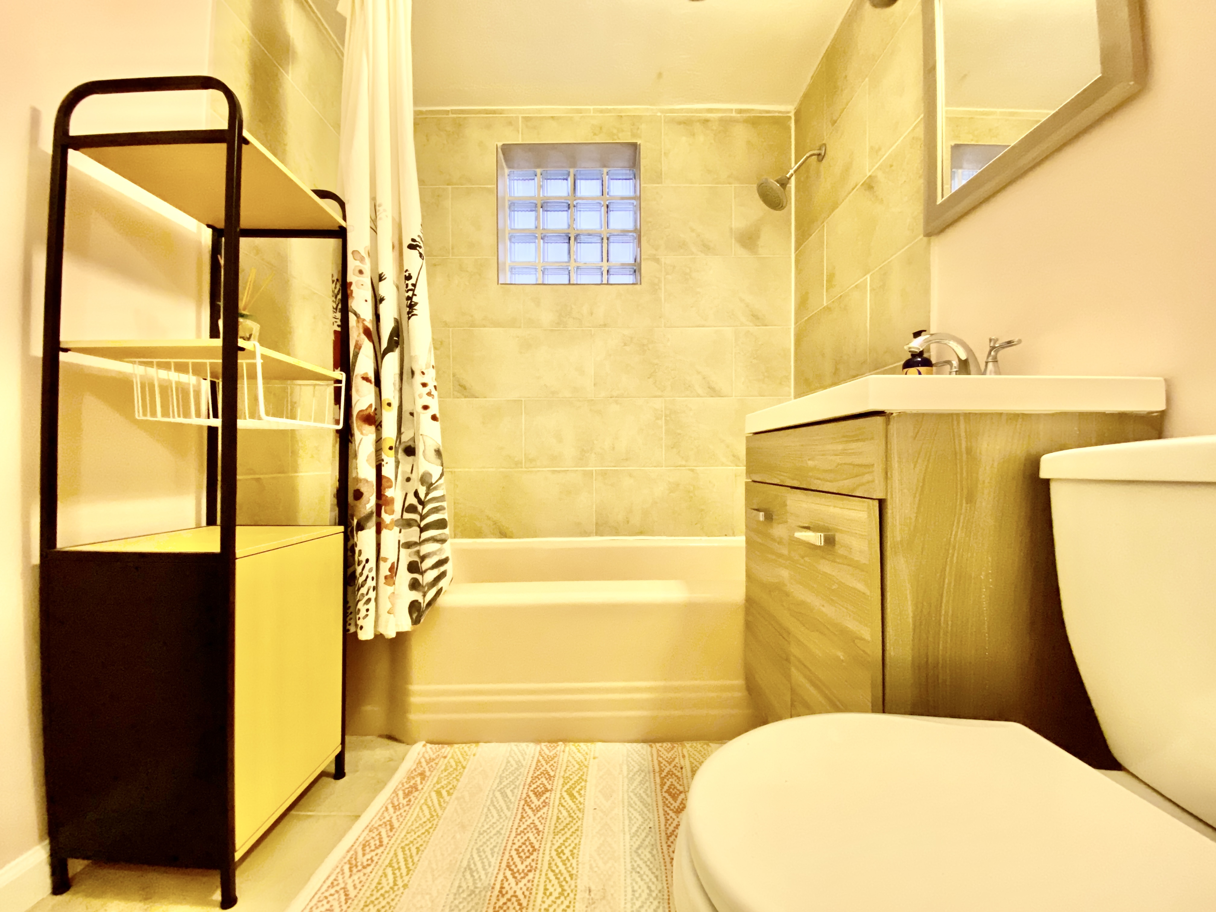 156 96th Street, Unit 1 Brooklyn, NY 11209 - Photo 7 of 7 a bathroom with a sink and a mirror