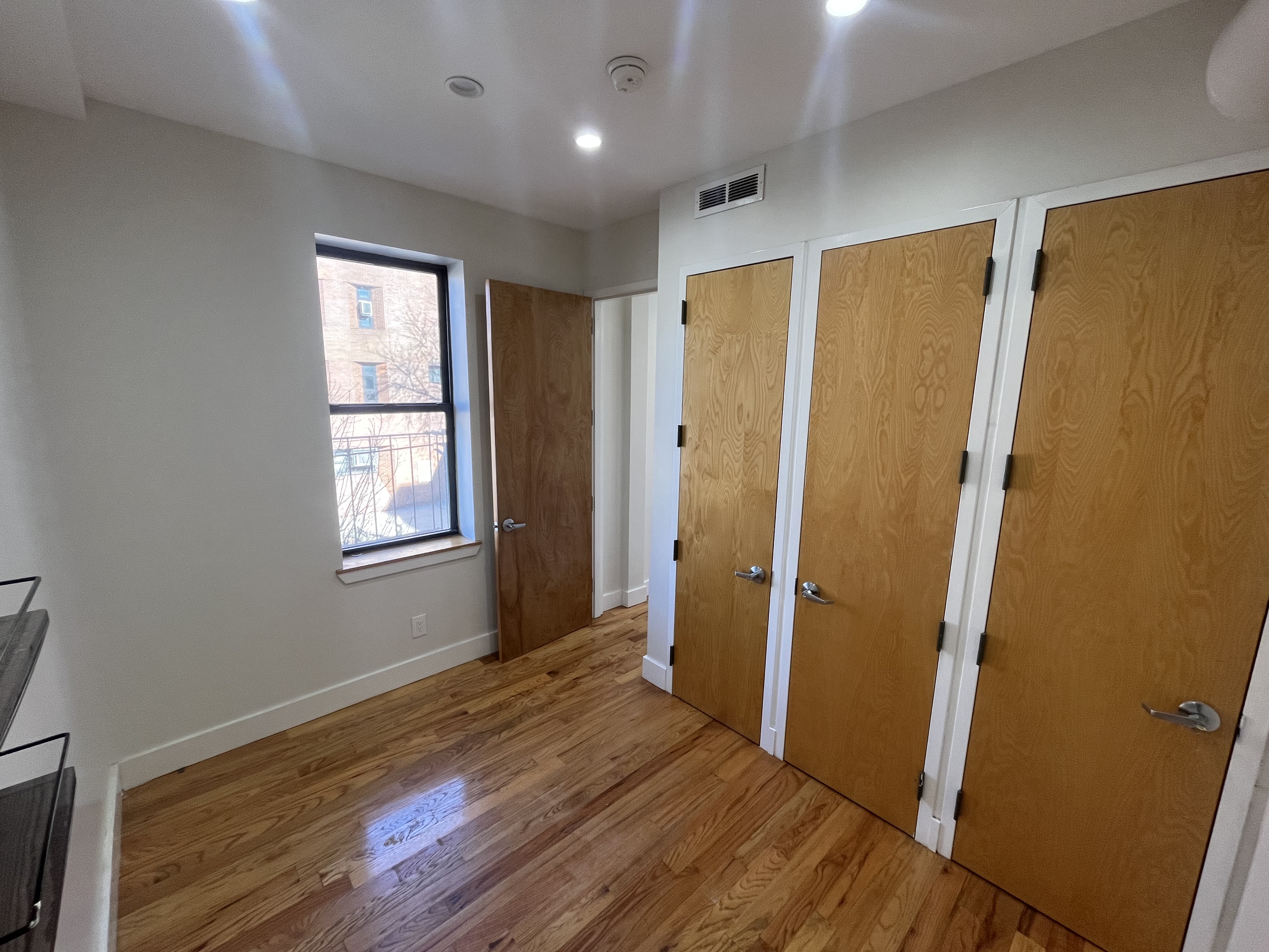 610 Monroe Street, Unit 2R Brooklyn, NY 11221 - Photo 4 of 6 a view of entryway with wooden floor