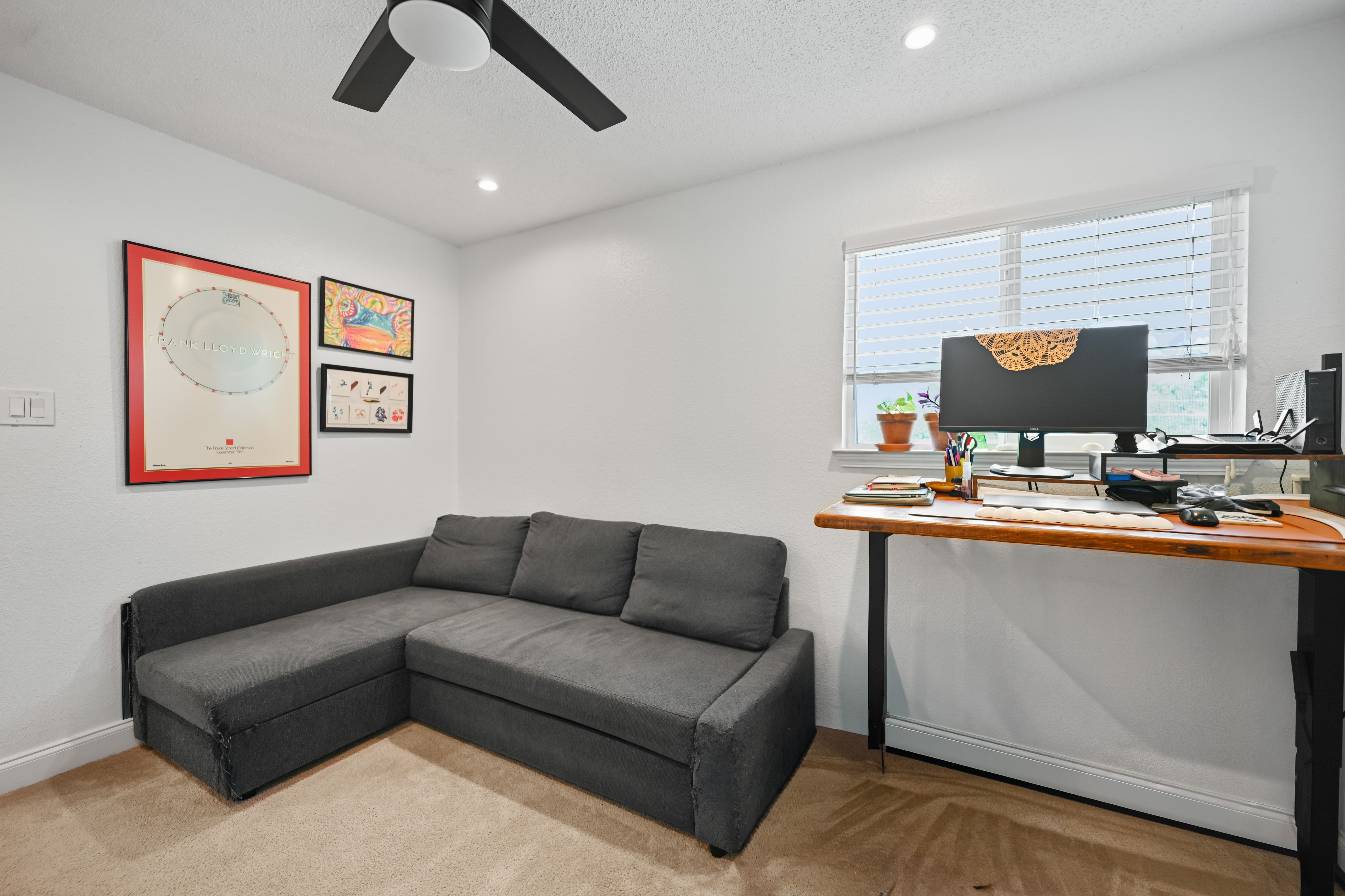 8710 Clearbrook Trail Austin, TX 78729 - Photo 8 of 28 a living room with furniture and a flat screen tv
