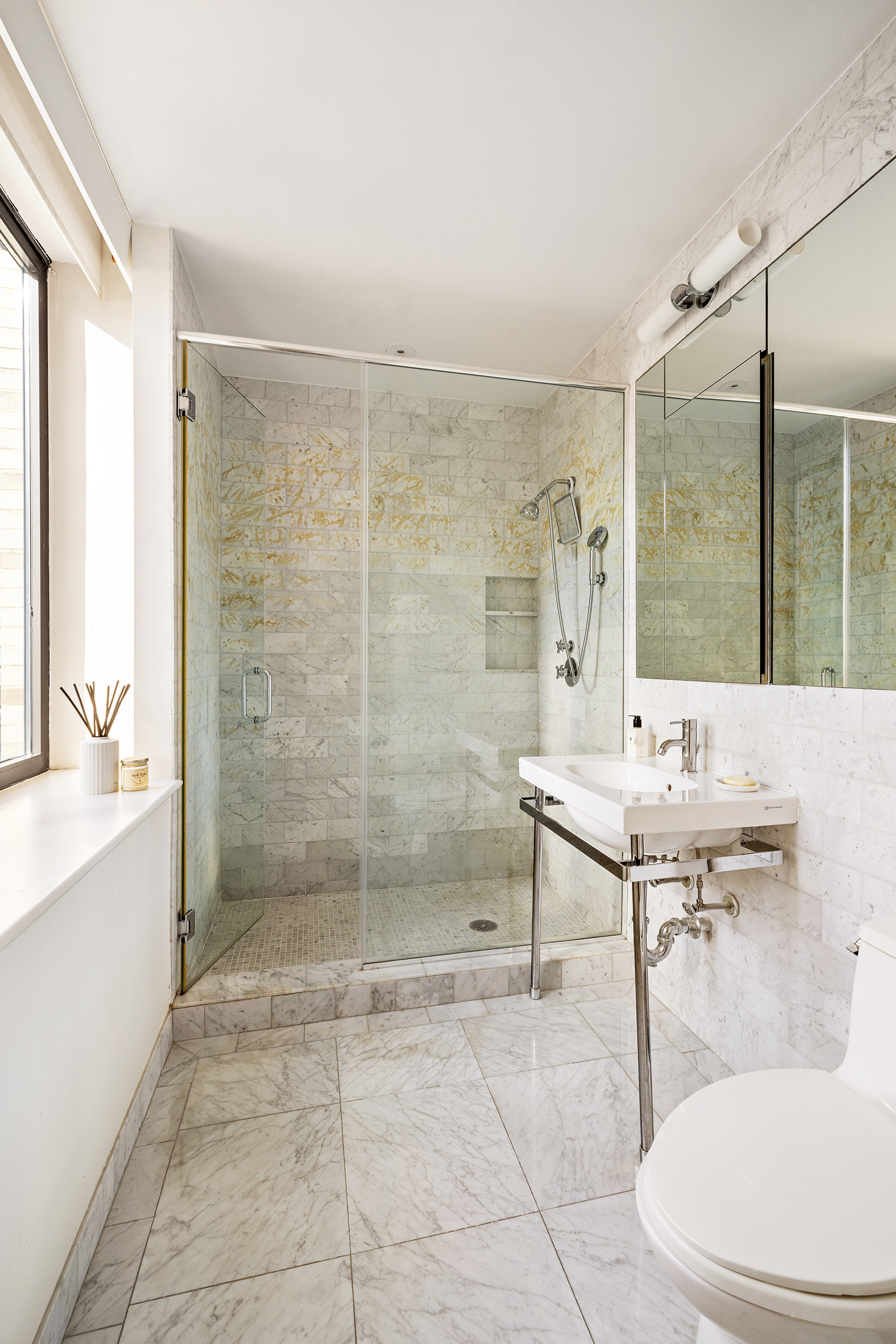 110 Central Park South, Unit PH1 Manhattan, NY 10019 - Photo 21 of 26 a bathroom with a sink toilet and shower