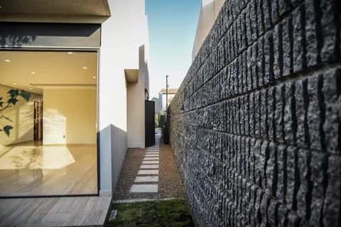 a front view of a building with garden