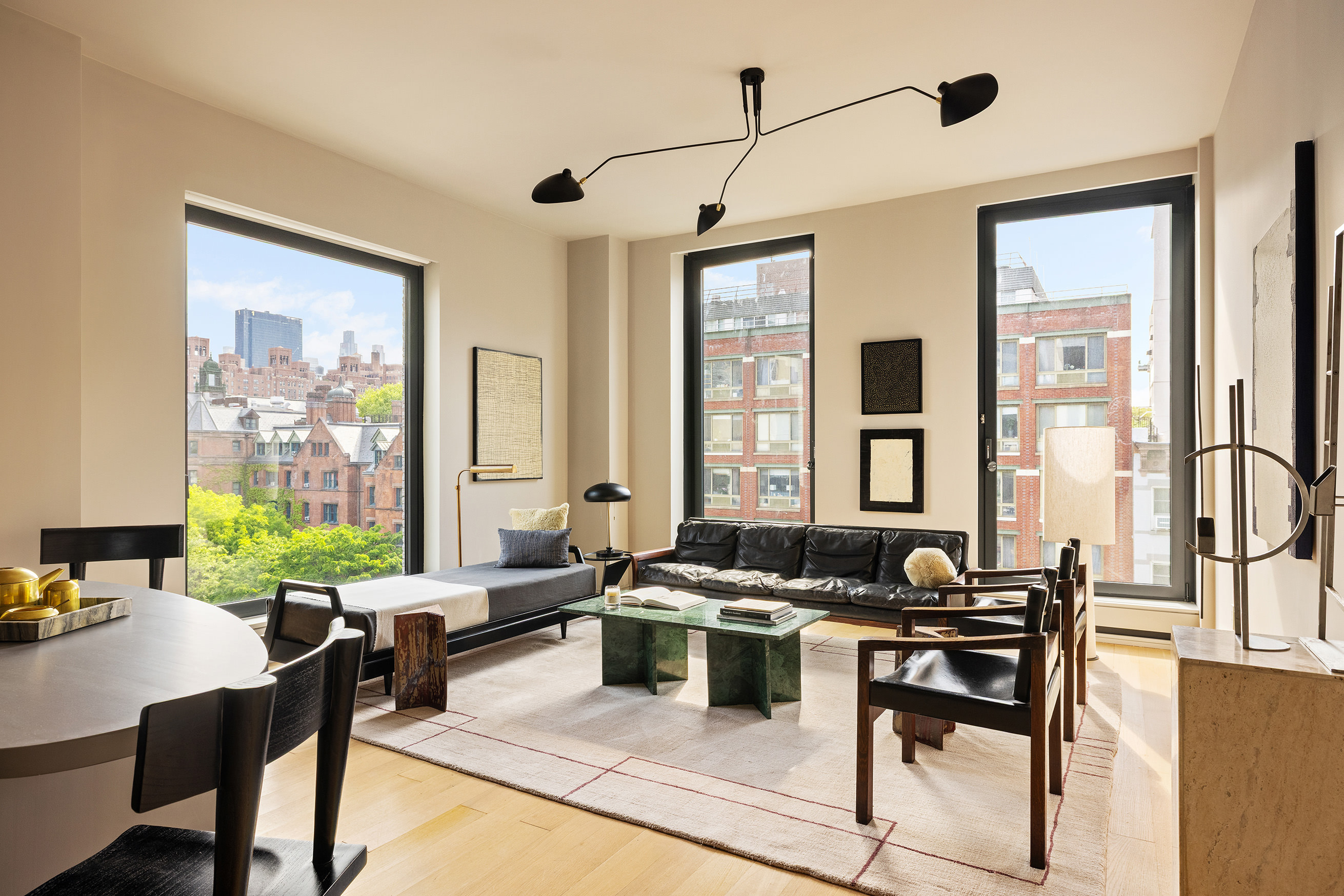505 West 19th Street, Unit 5D Manhattan, NY 10011 - Photo 2 of 17 a living room with furniture potted plant and a large window